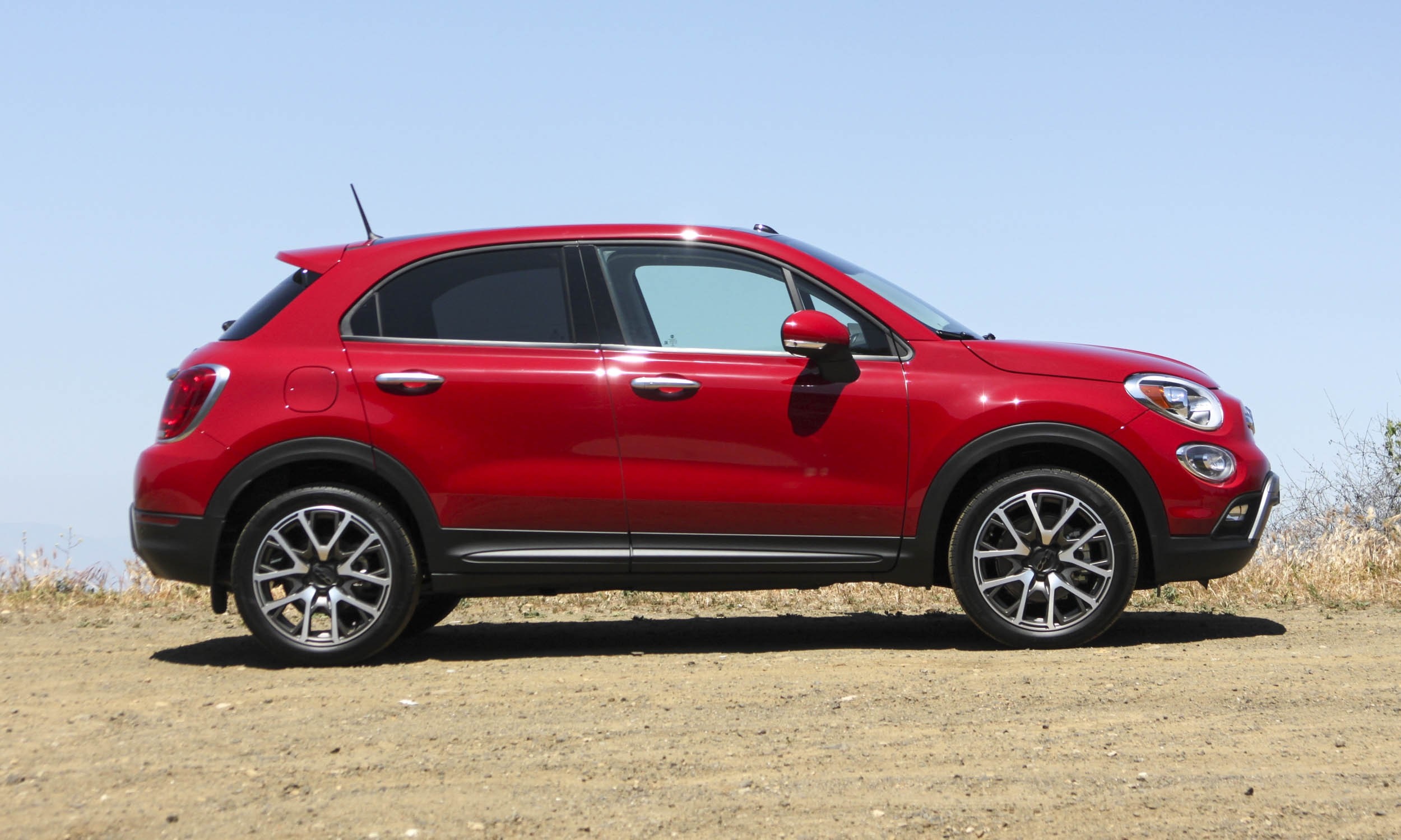 Red Fiat 500X parked on a dirt road HD Wallpaper