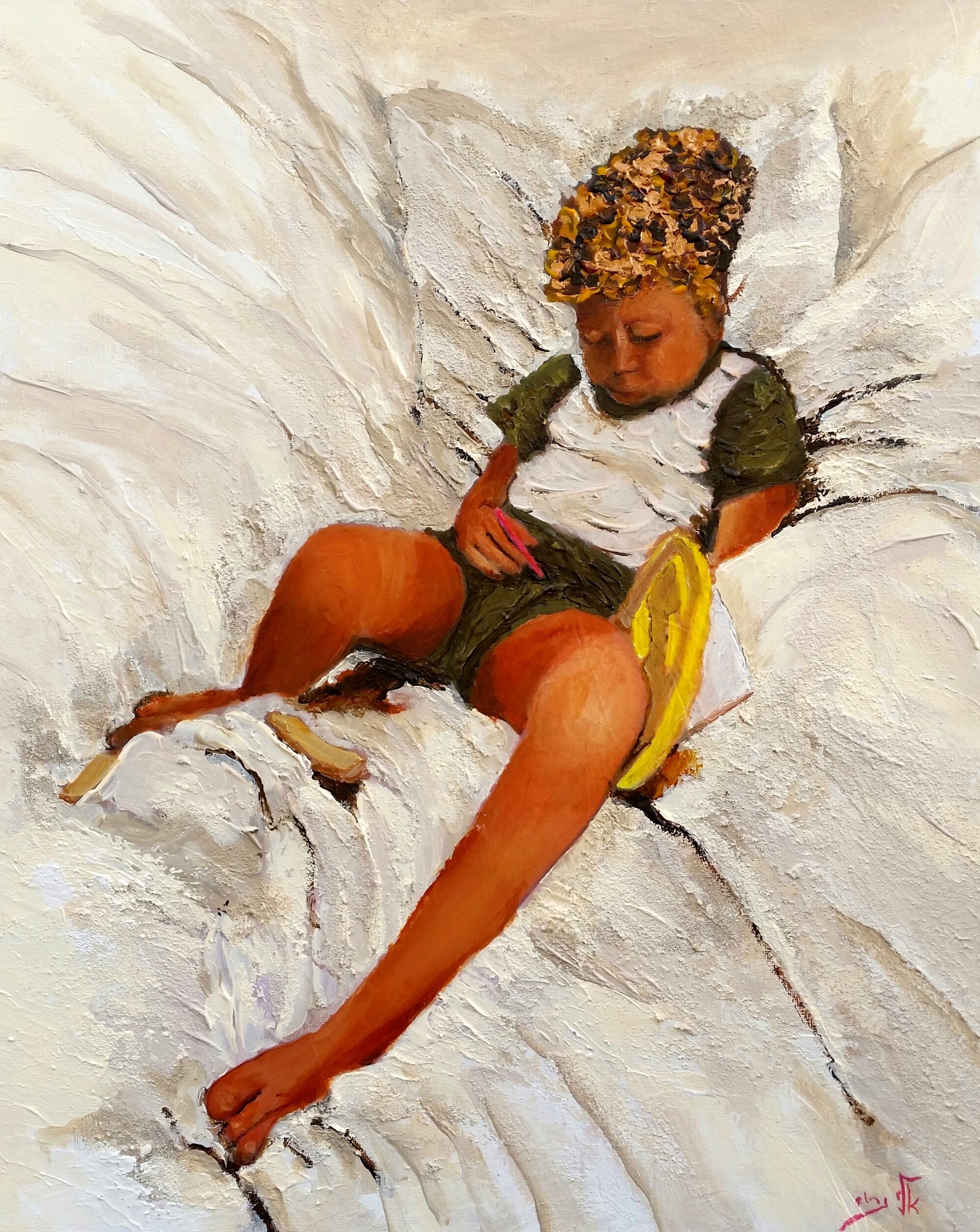 Child reclining on white fabric, holding a yellow object HD Wallpaper