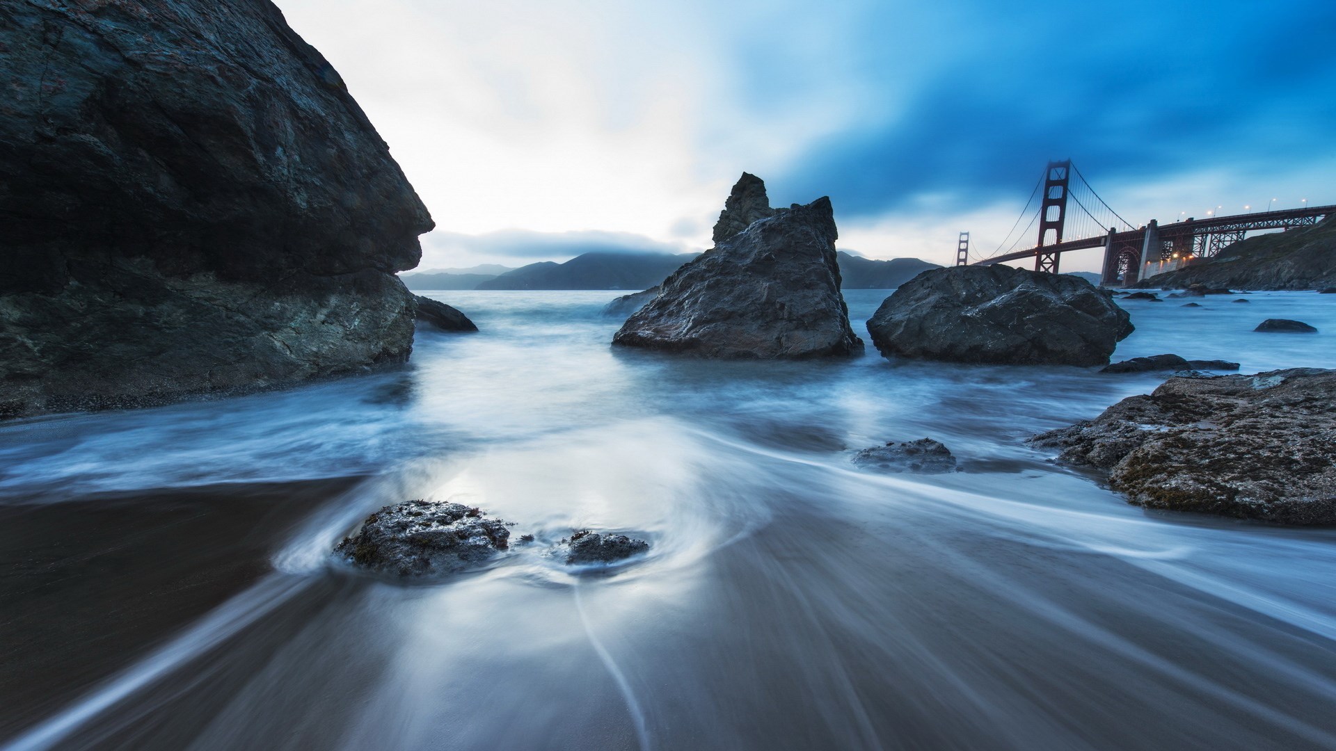 Golden Gate Bridge and rocky shore at dusk HD Wallpaper