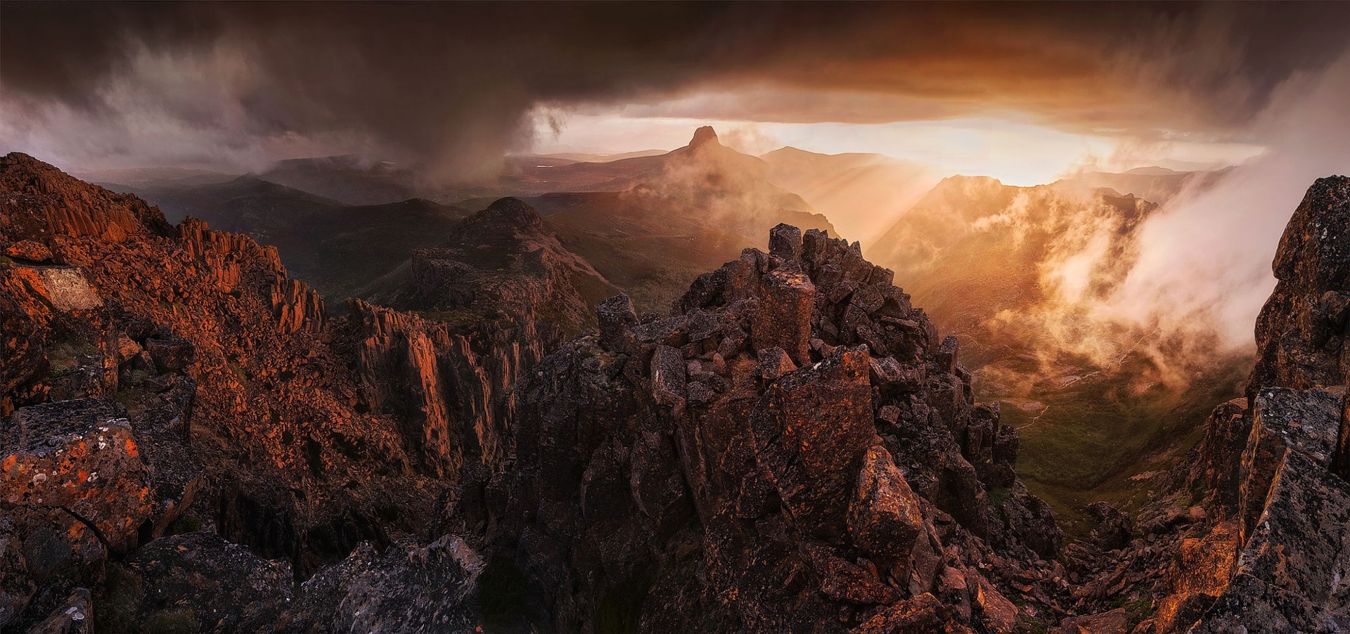 Dramatic mountain landscape at sunrise with storm clouds HD Wallpaper