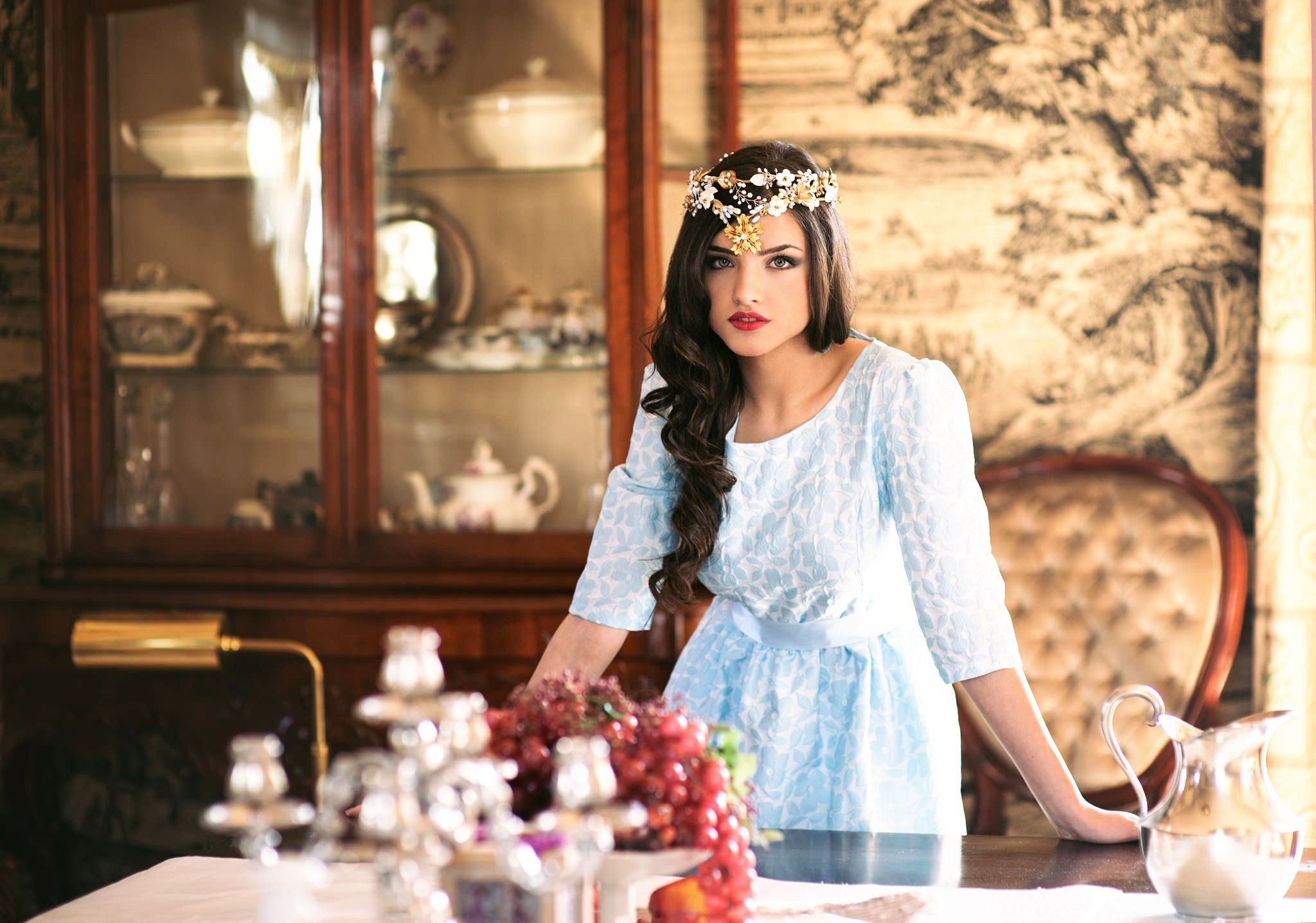 Woman with floral headpiece in ornate room HD Wallpaper