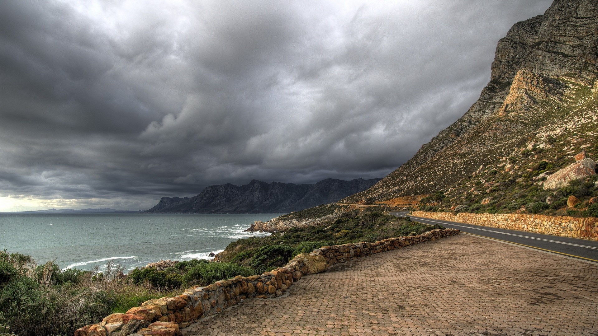 Coastal road with mountains and stormy sea HD Wallpaper