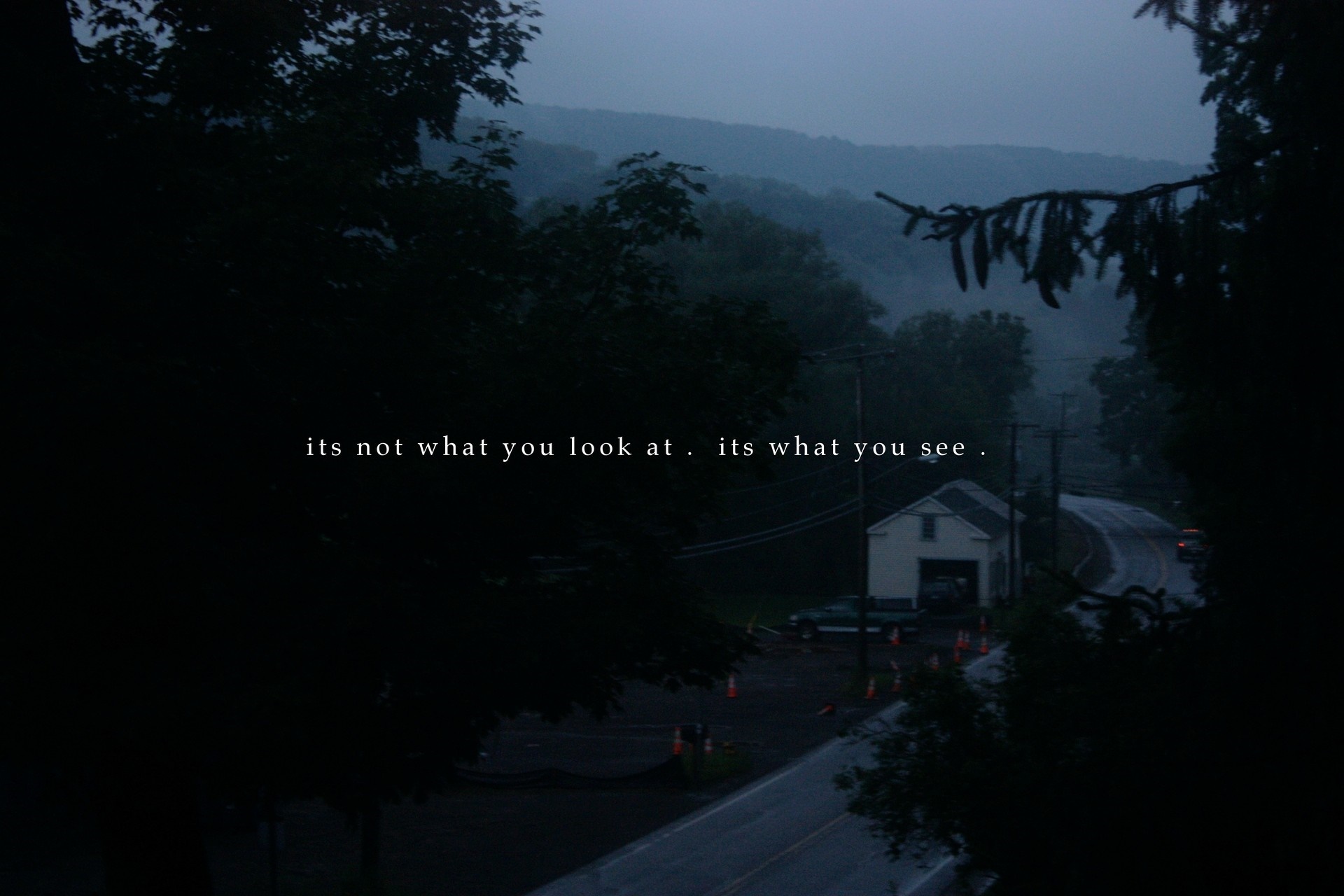 Text on a foggy landscape with a house and road HD Wallpaper
