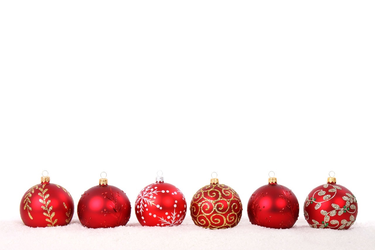 Red Christmas ornaments on snow HD Wallpaper