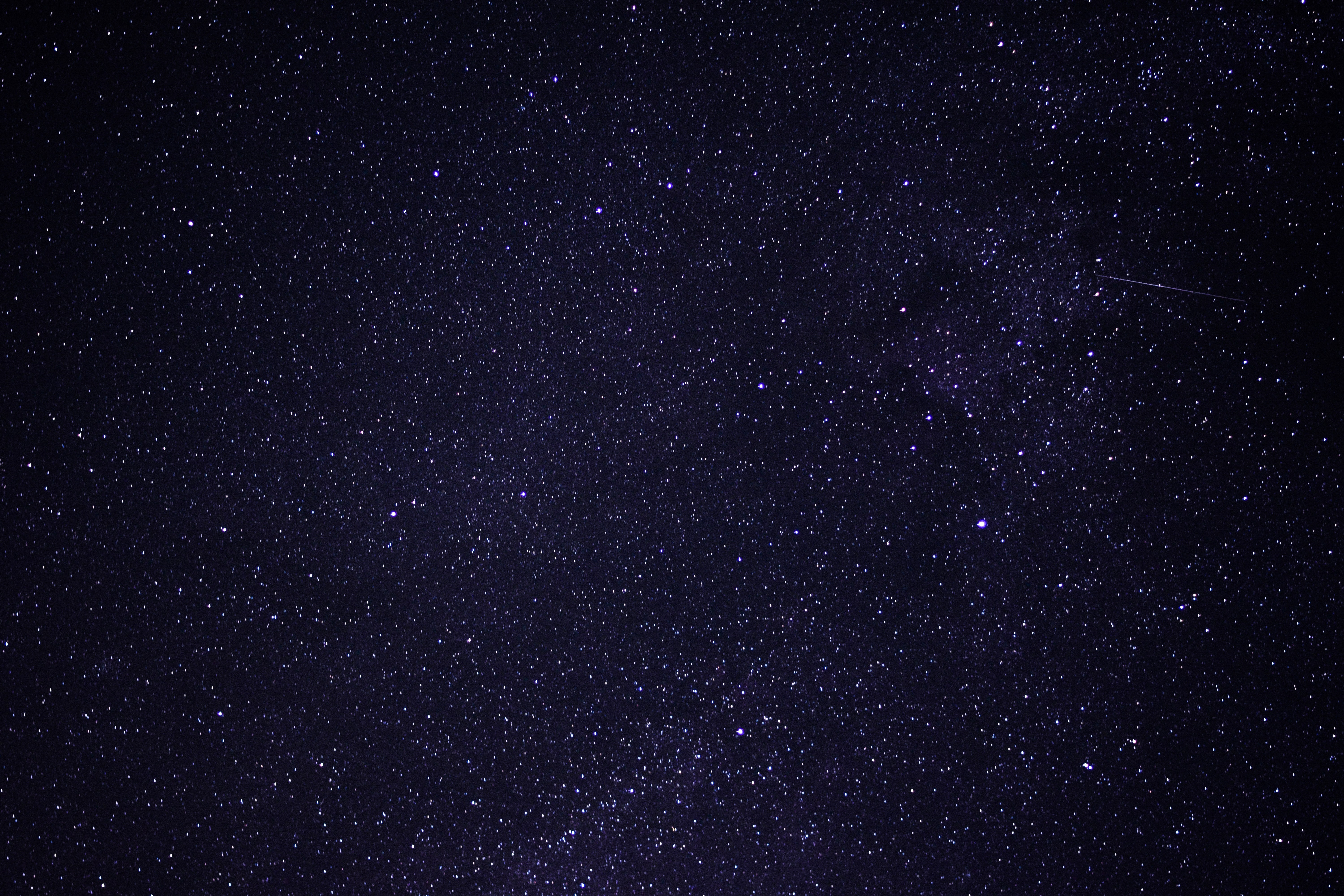 Starry night sky with a meteor shower HD Wallpaper
