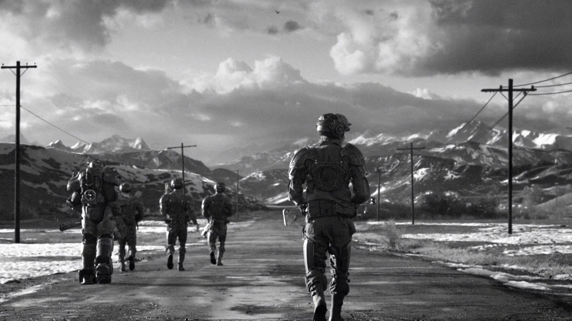 Soldiers in power armor walking on a road with mountains HD Wallpaper