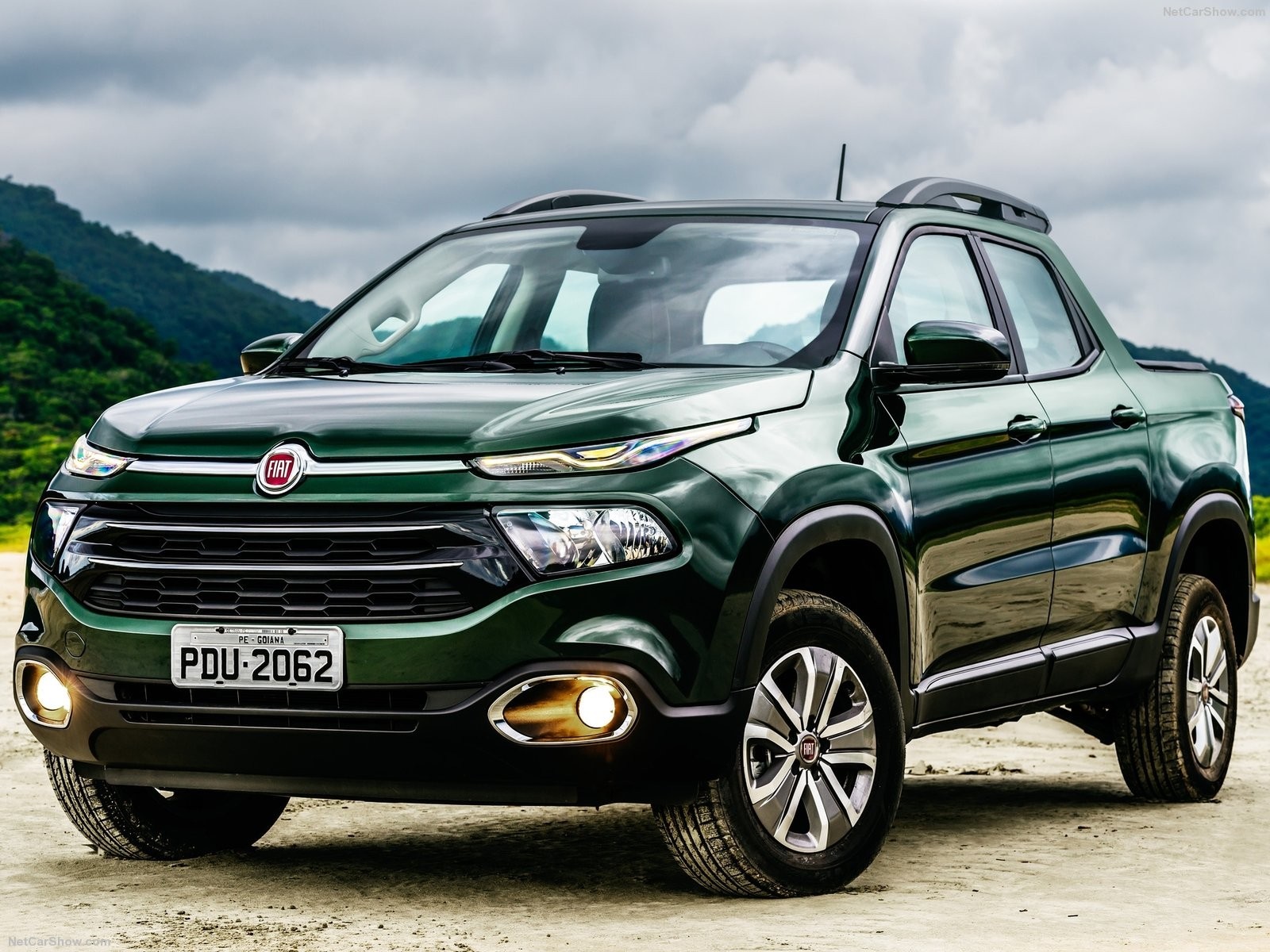 Green Fiat Toro pickup truck on a dirt road HD Wallpaper