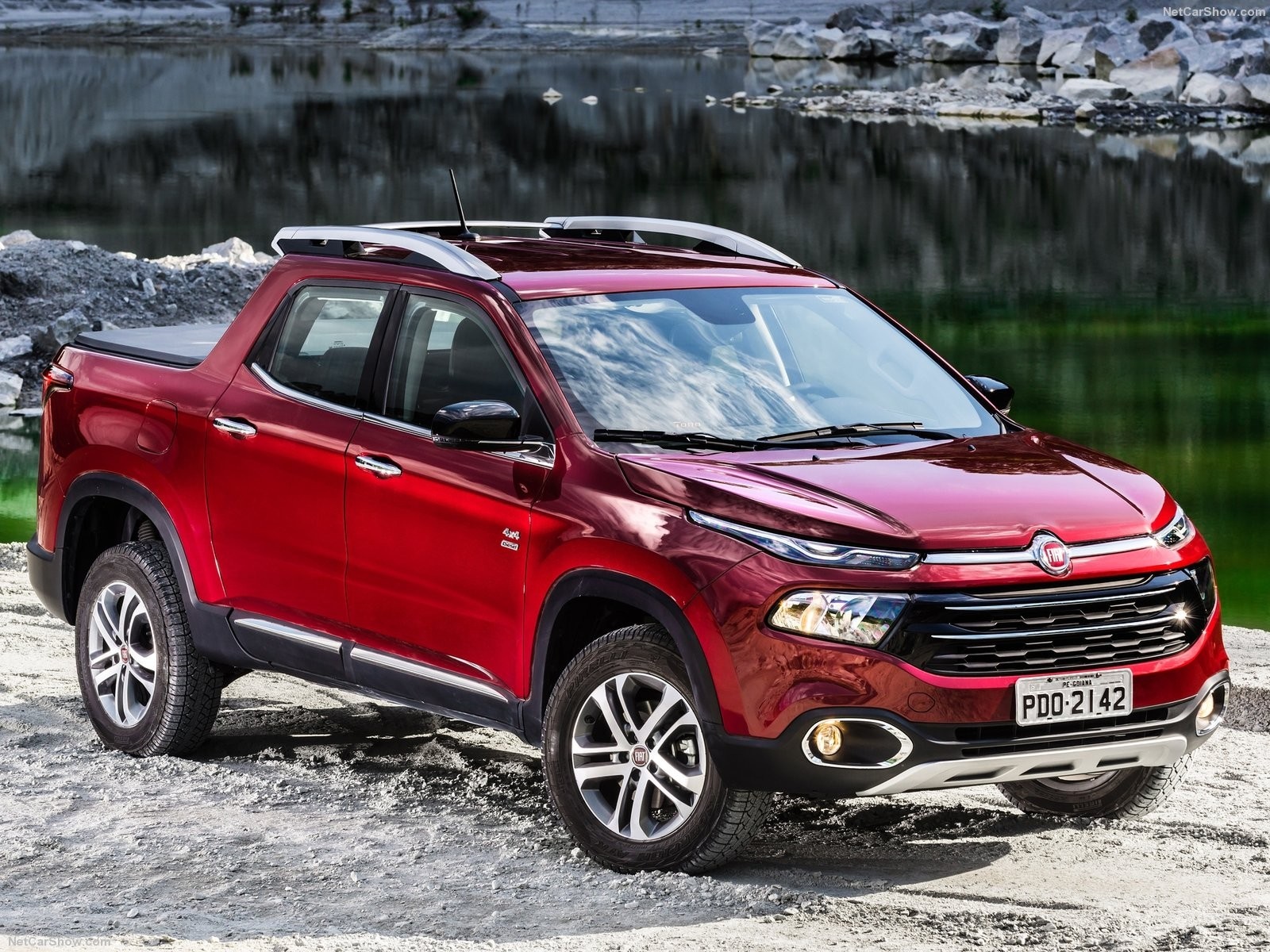 Red Fiat Toro pickup truck parked by a lake HD Wallpaper