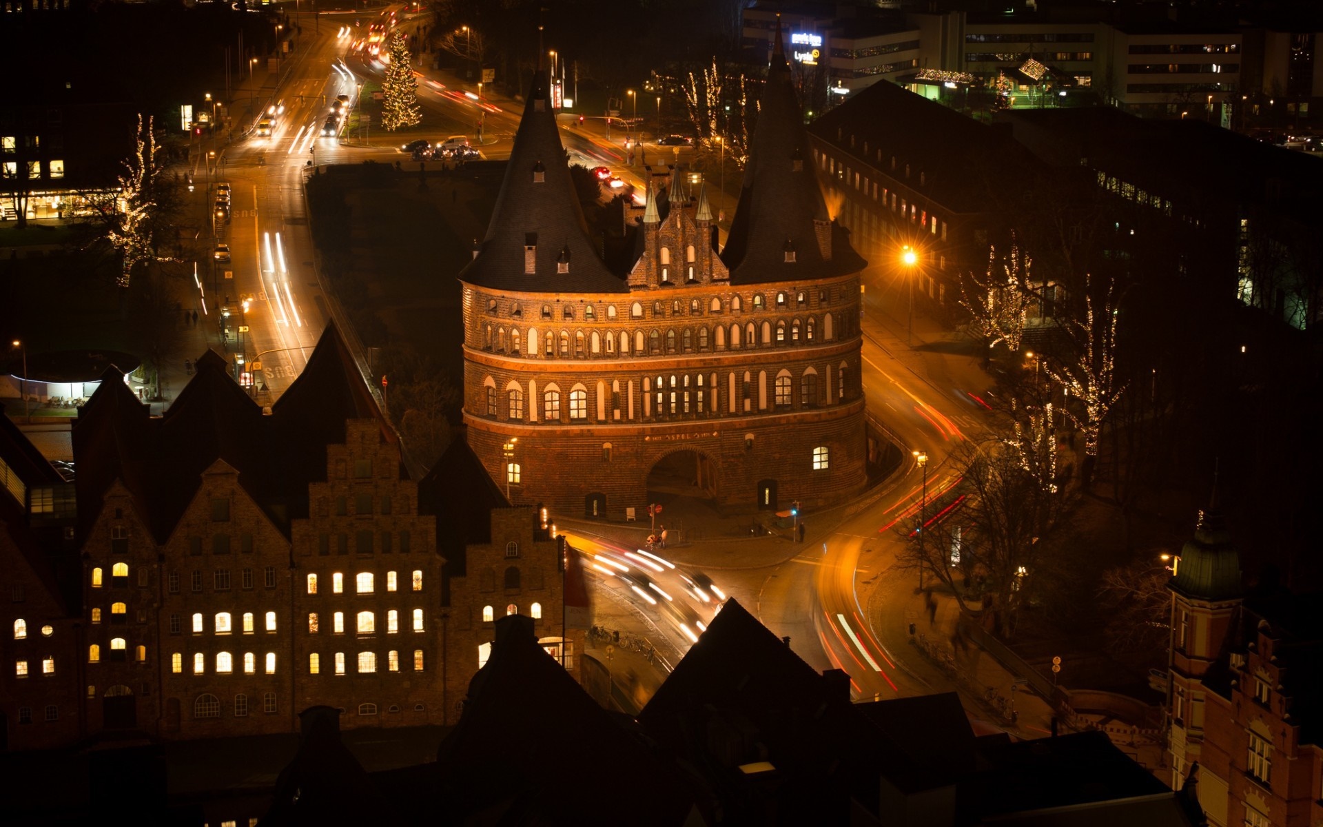 Holsten Gate and city at night with light trails HD Wallpaper