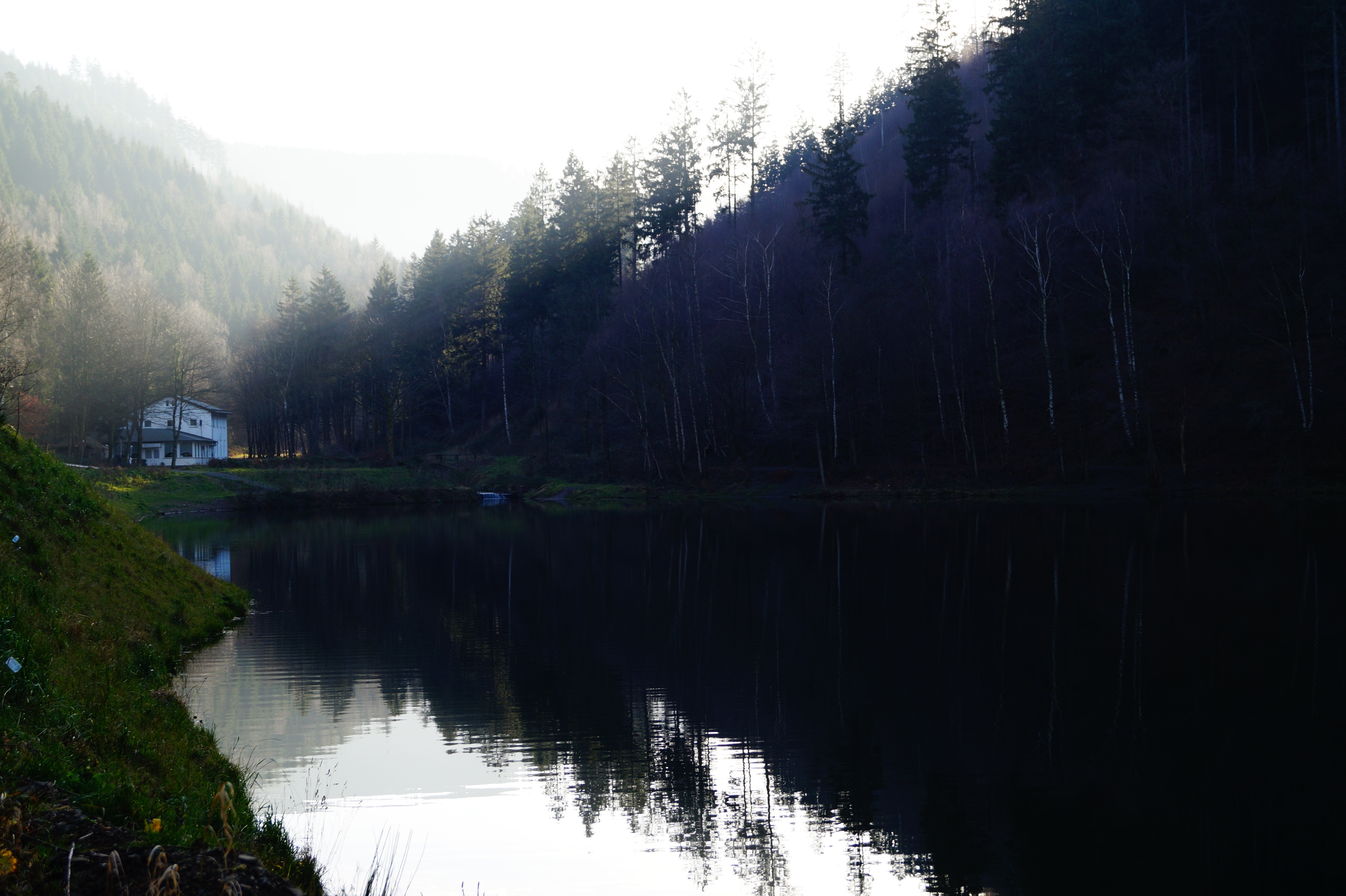 House by a lake with misty forest and reflections HD Wallpaper