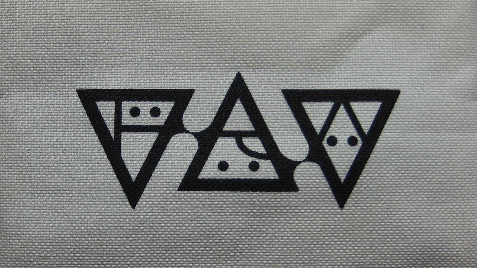 Black geometric logo with triangles and dots on gray fabric HD Wallpaper