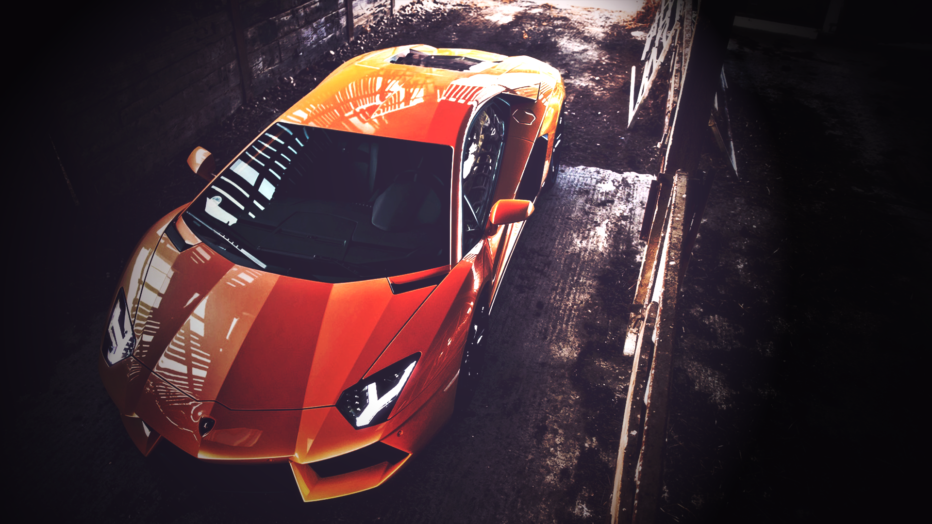 Orange Lamborghini Aventador parked in a gritty garage HD Wallpaper