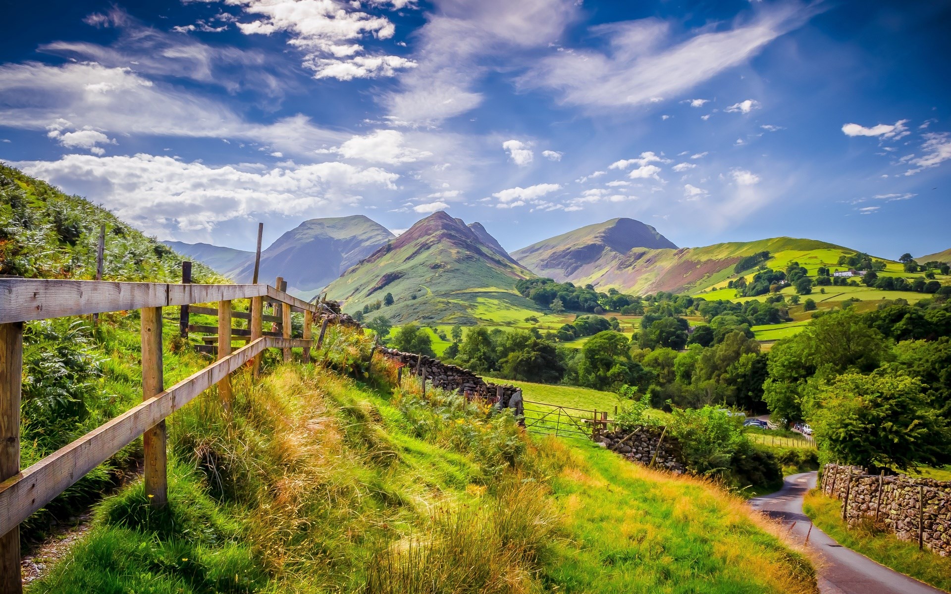 Green hills and mountains with a wooden fence HD Wallpaper