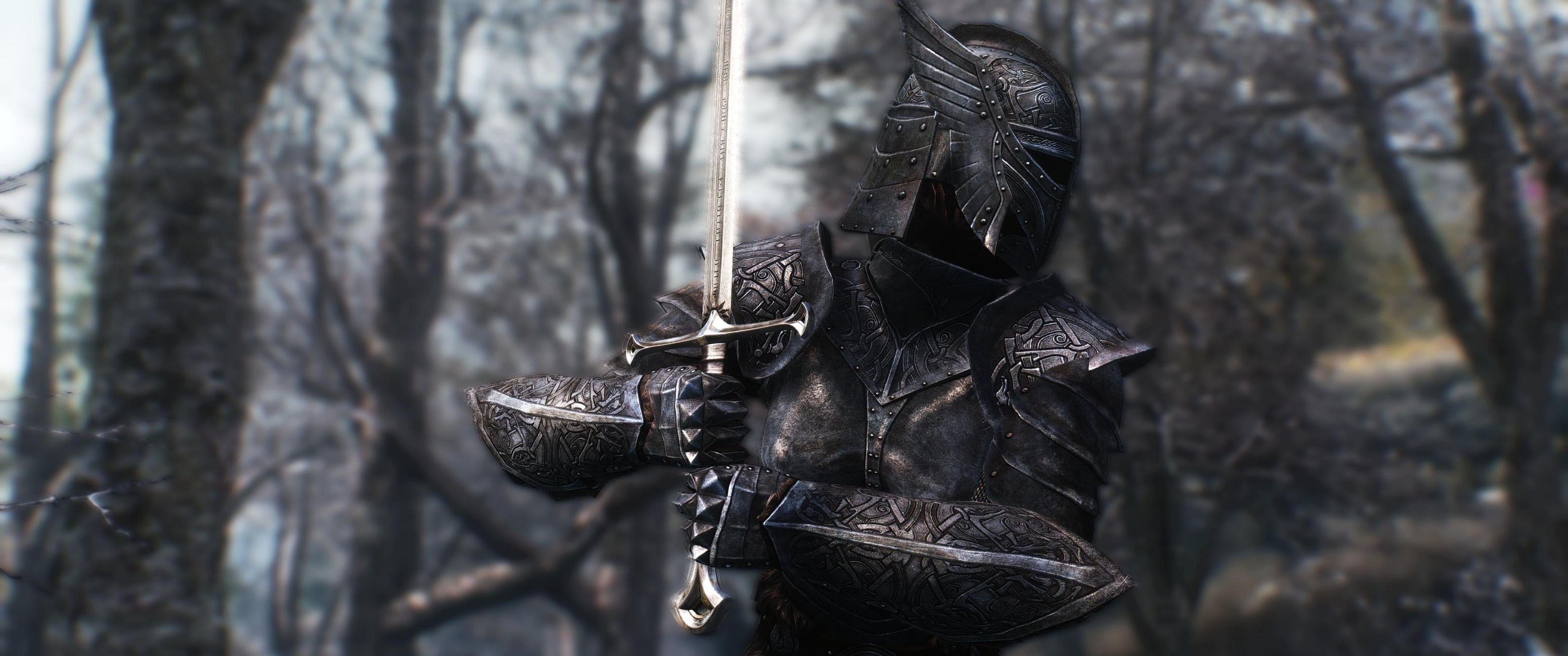 Knight in black armor holding a sword in a forest HD Wallpaper