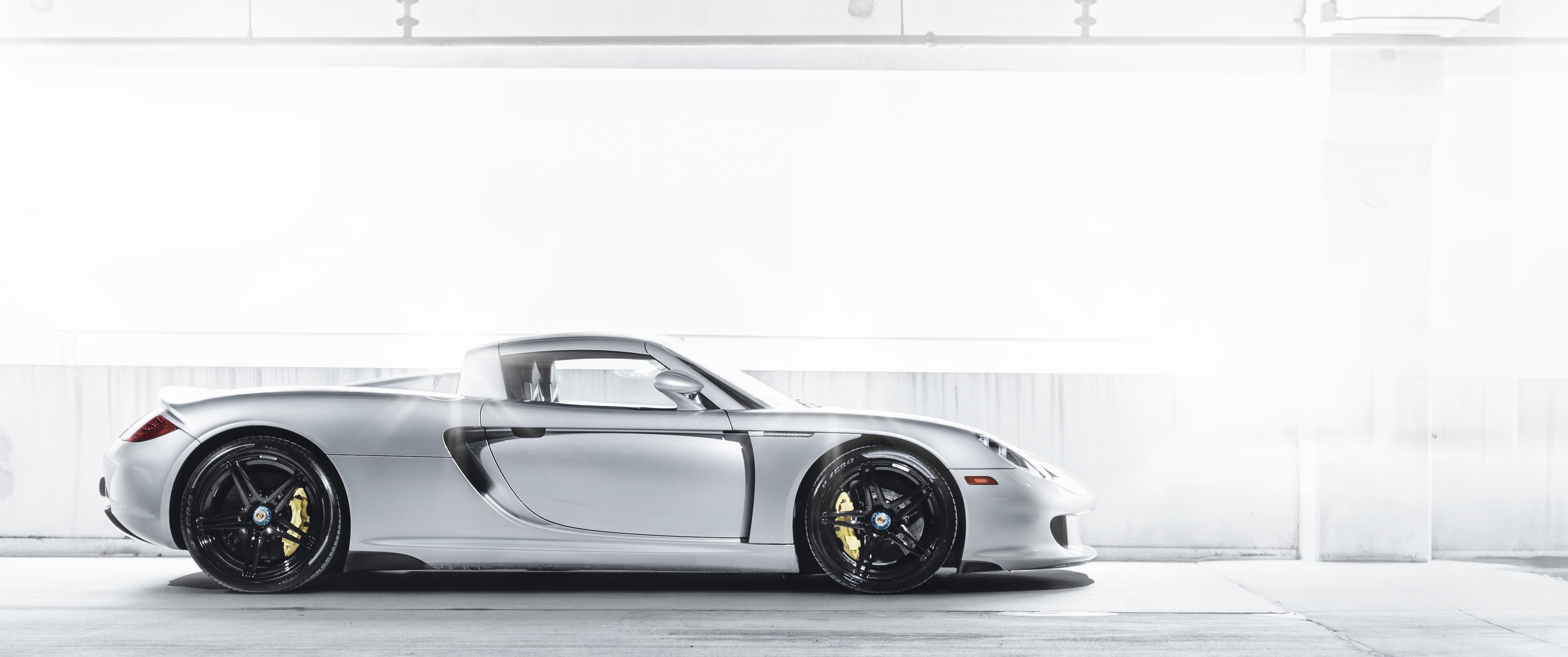 Silver Porsche Carrera GT sports car HD Wallpaper