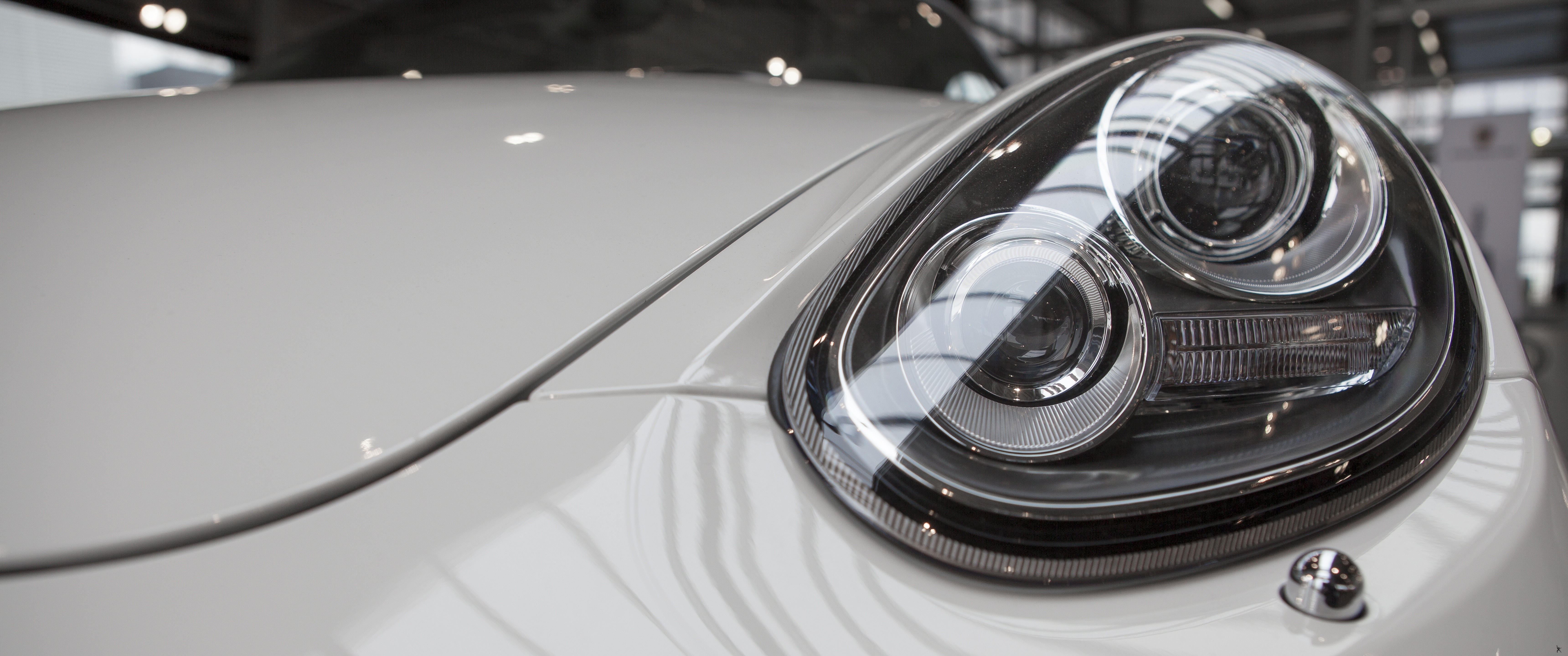 White Porsche sports car headlight HD Wallpaper