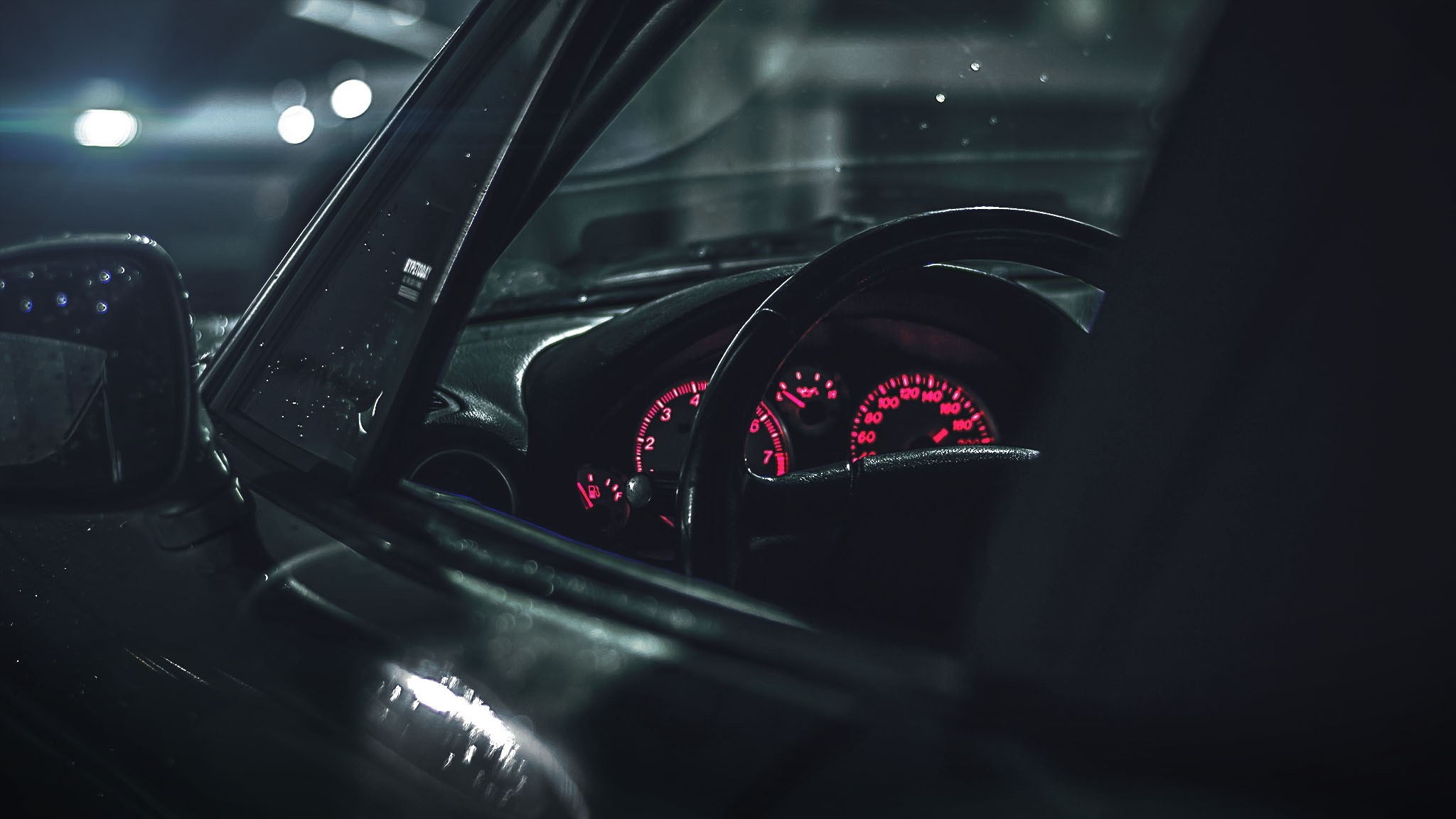 Car interior with glowing red dashboard lights HD Wallpaper