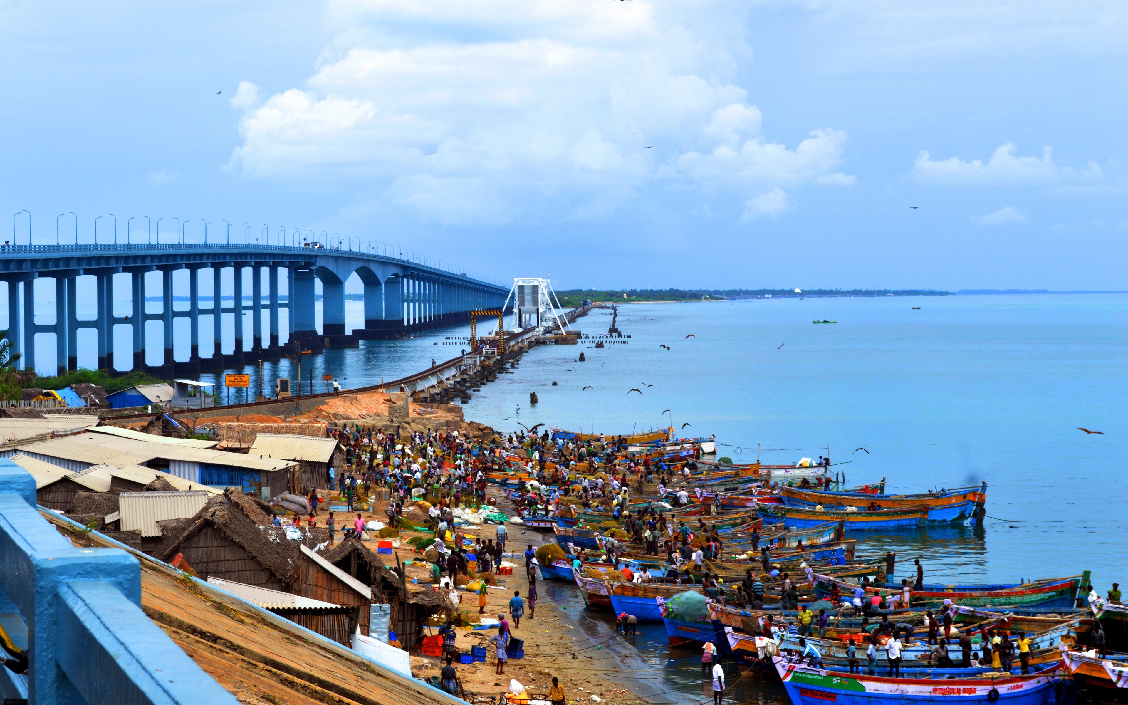 Fishing village and bridge over the sea in India HD Wallpaper