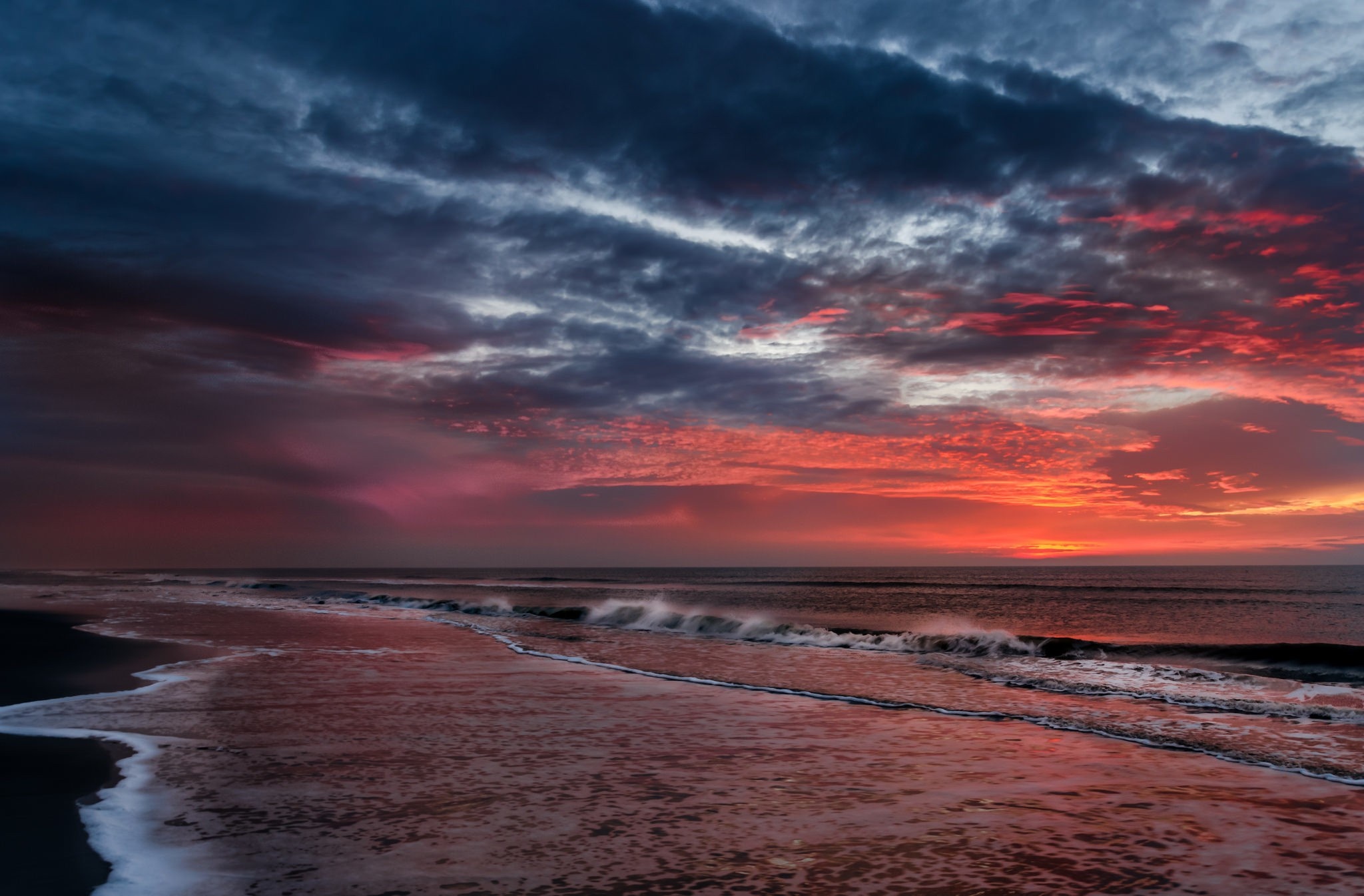 Sunset over the ocean with dramatic clouds HD Wallpaper