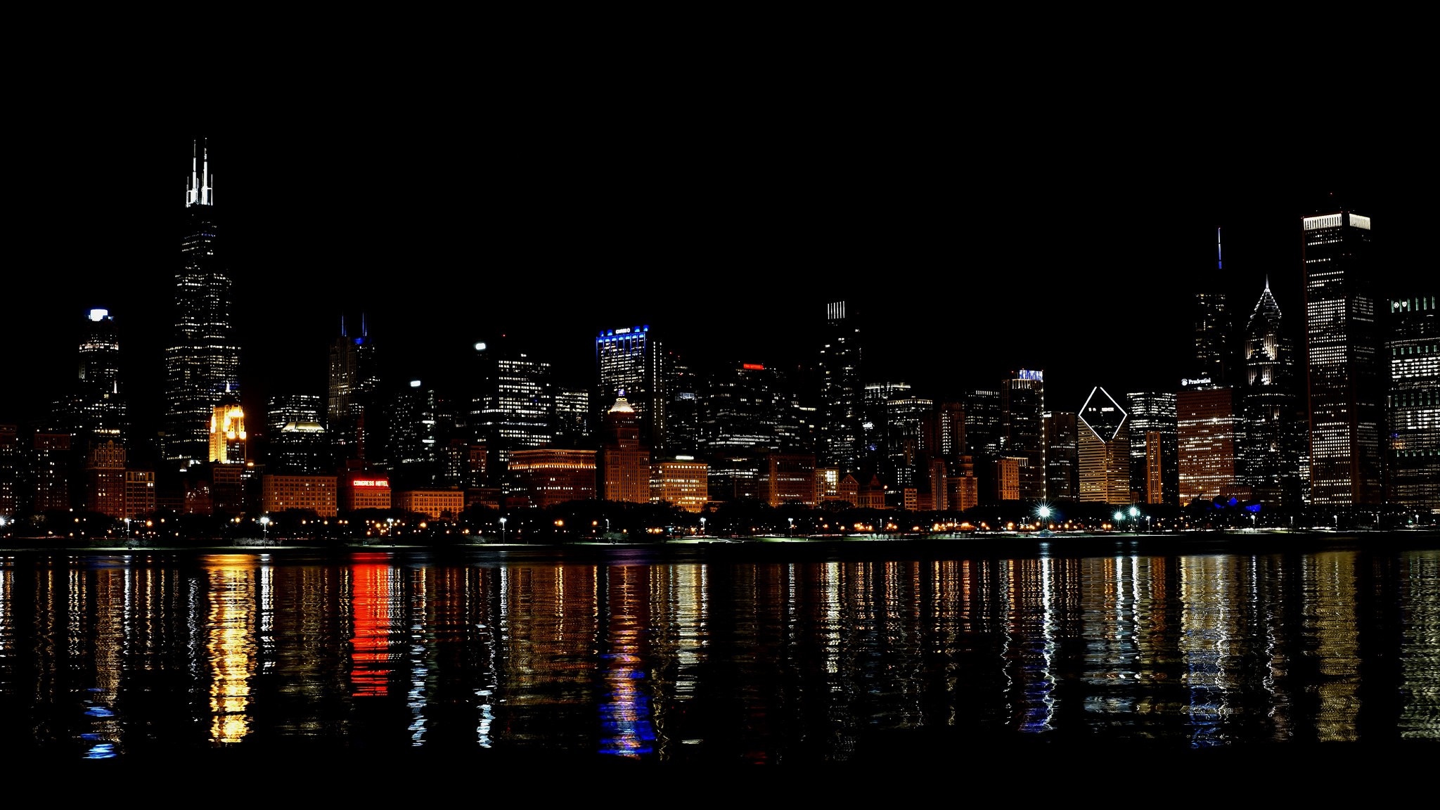 Chicago skyline at night with reflections on the water HD Wallpaper