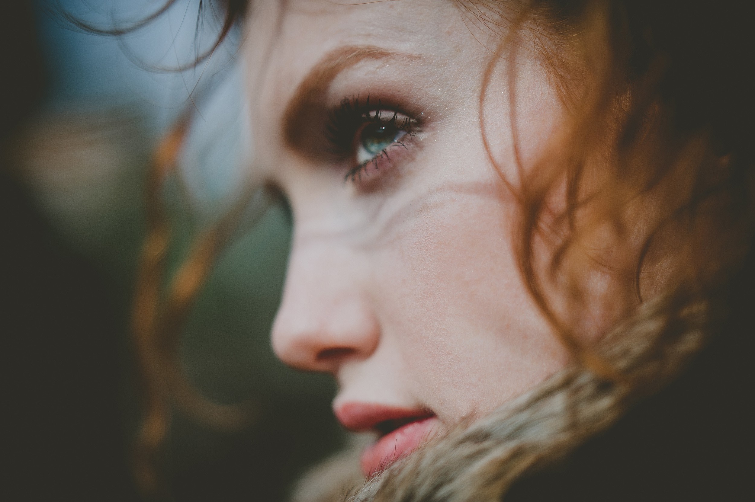 Close-up portrait of a woman with red hair and blue eyes HD Wallpaper