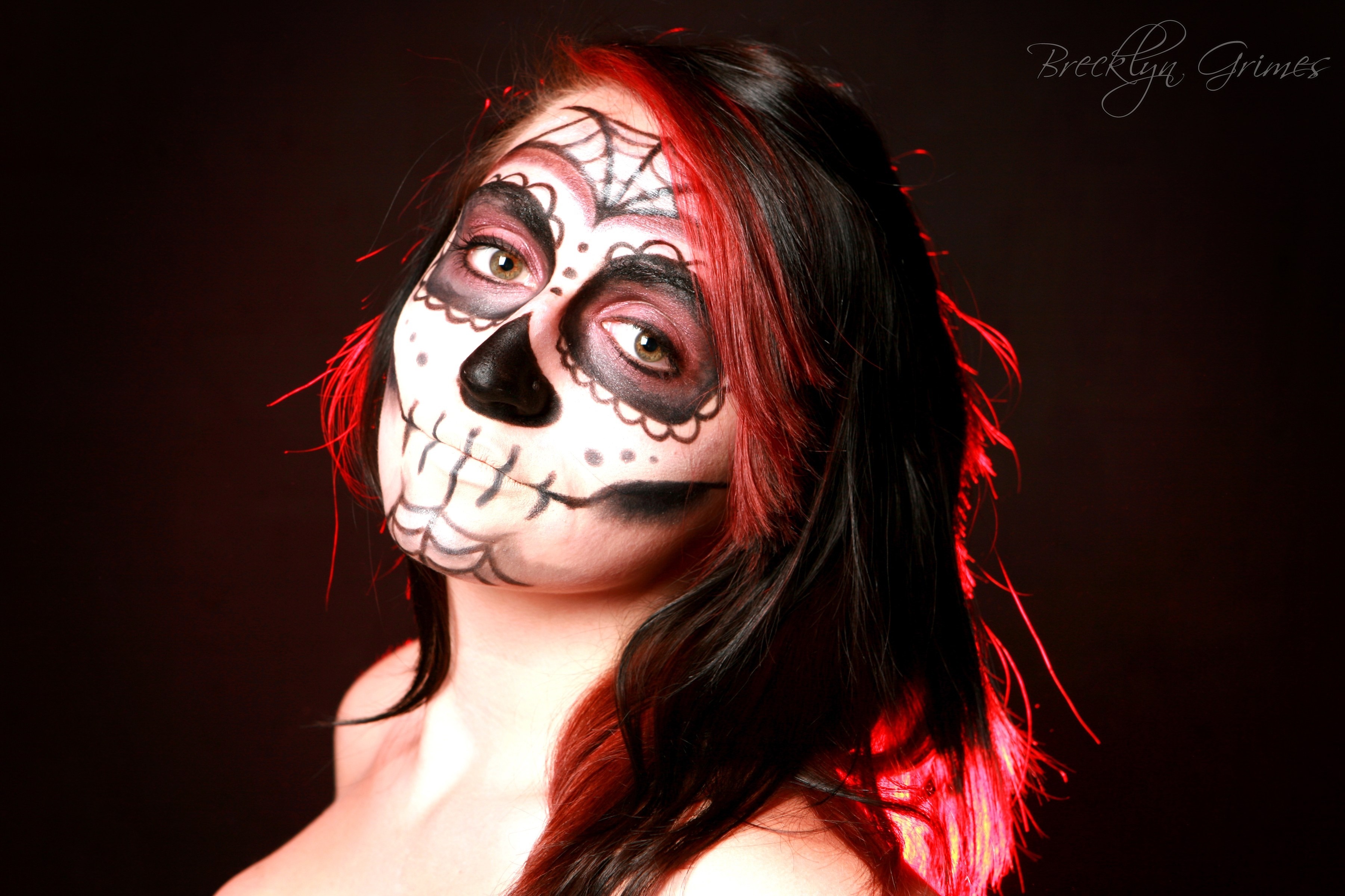 Woman with Sugar Skull makeup and red streaks in hair HD Wallpaper