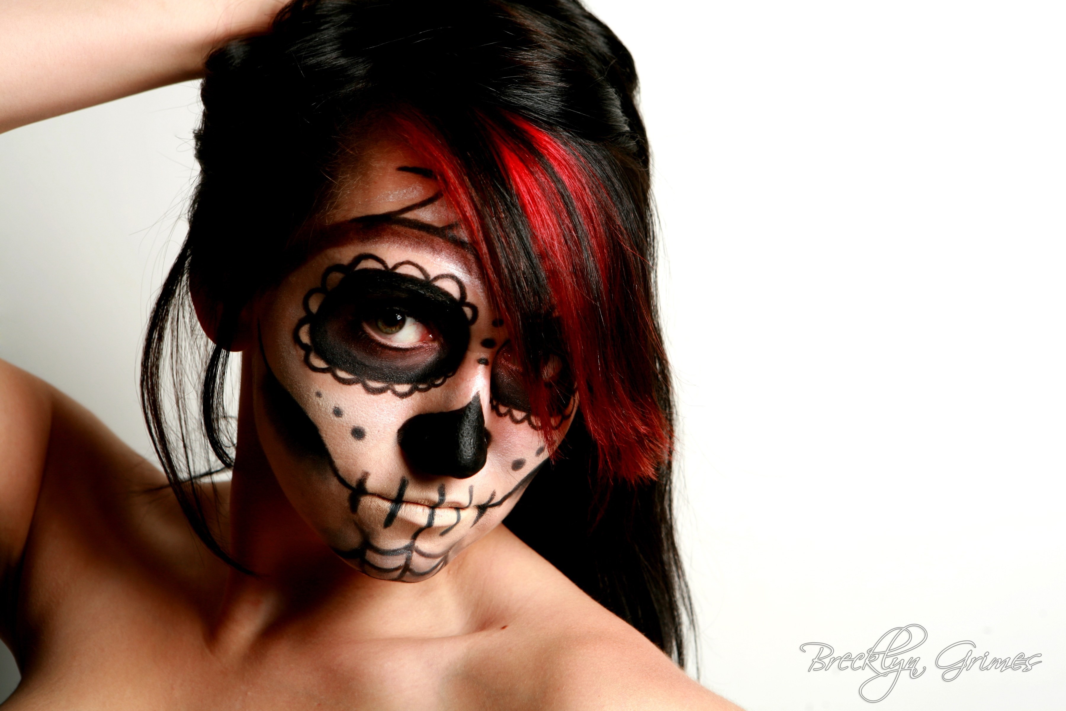 Woman with Sugar Skull makeup and red streaks in hair HD Wallpaper