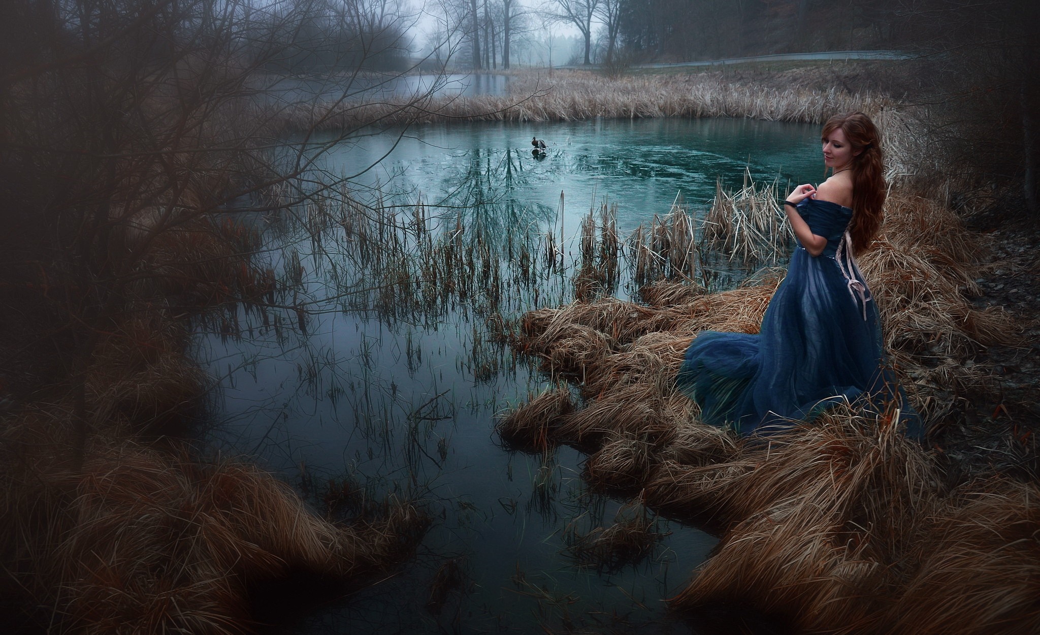 Woman in blue dress by a lake in autumn HD Wallpaper