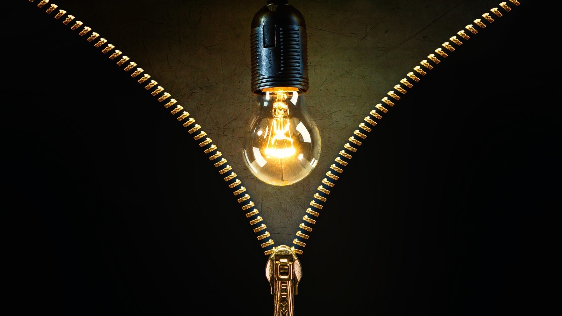Lightbulb behind a zipper on a dark background HD Wallpaper