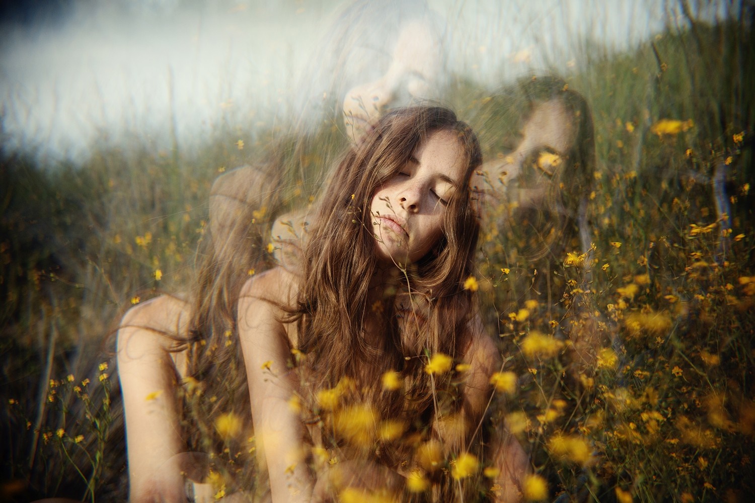 Woman in a field of yellow flowers with multiple exposures HD Wallpaper