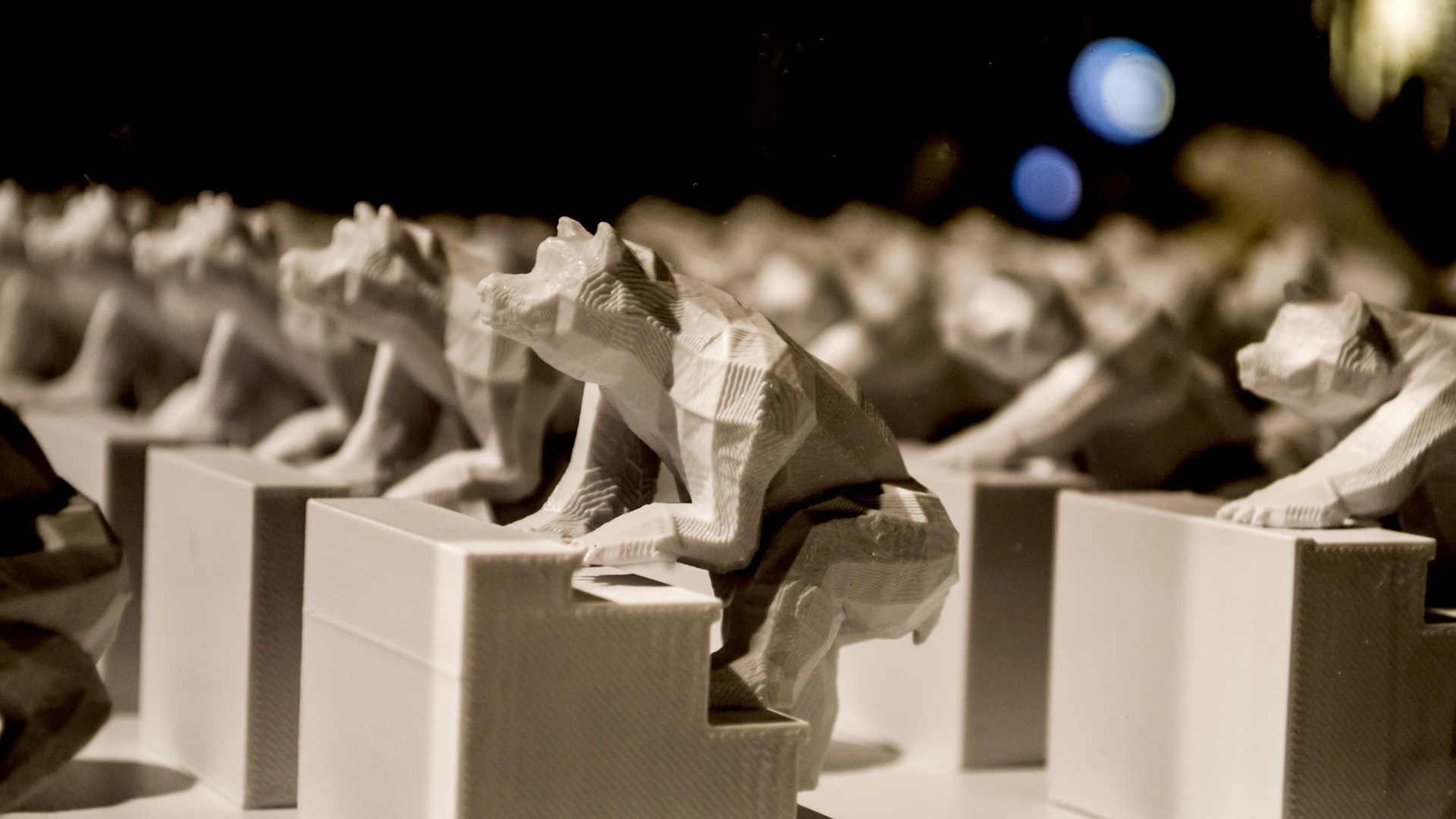 Row of 3D printed bear sculptures on stairs HD Wallpaper
