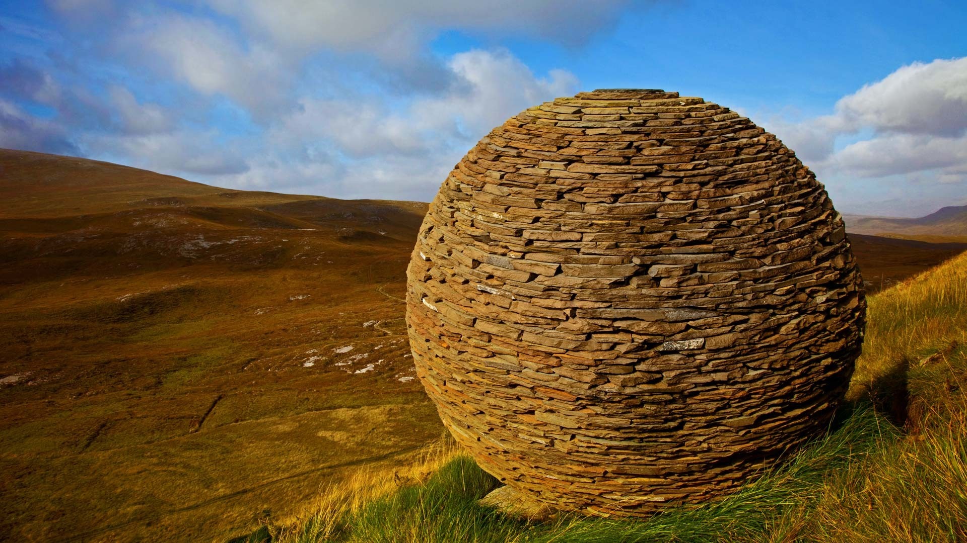 Stone sphere sculpture in a Scottish landscape HD Wallpaper