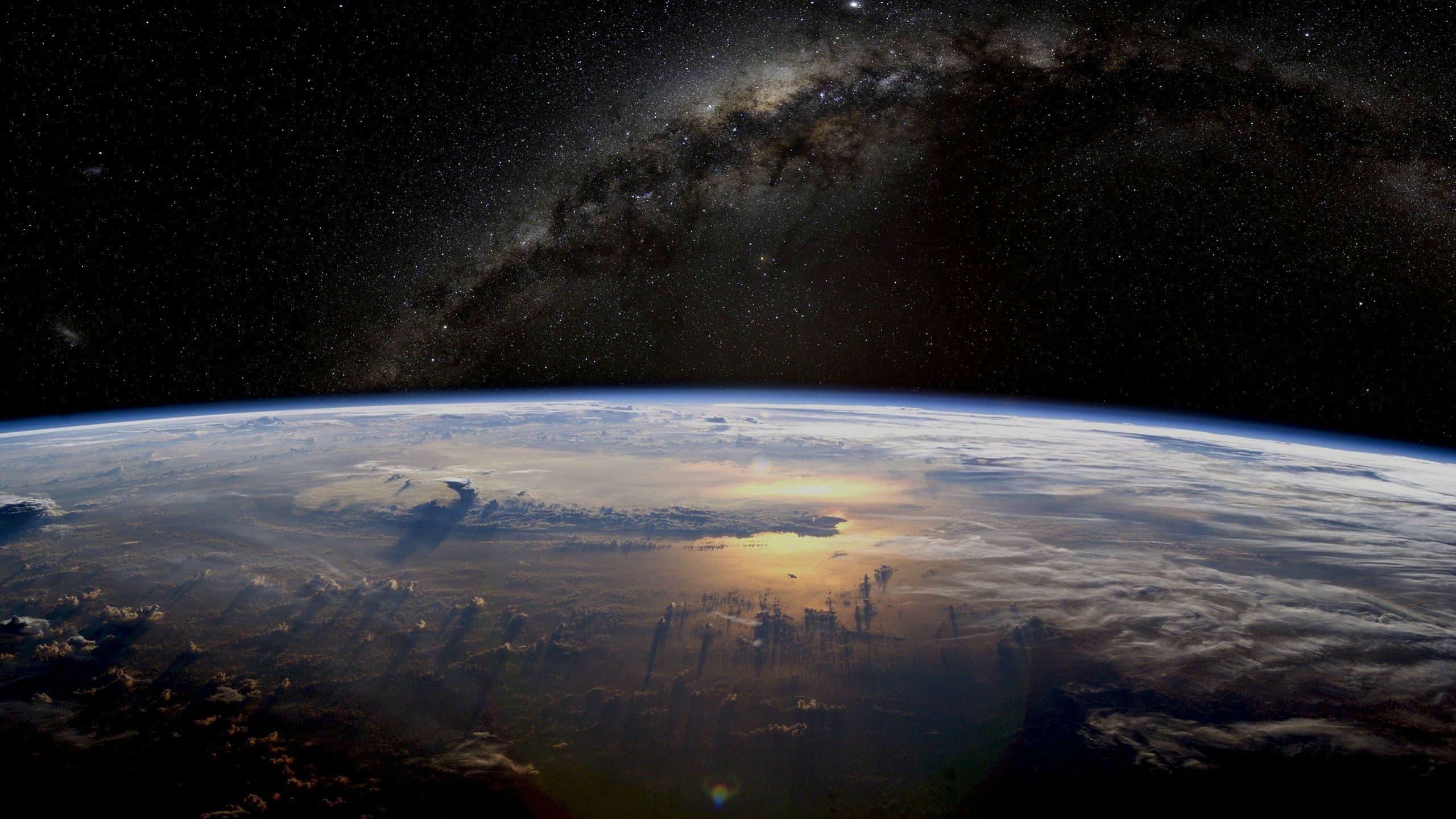 Earth and Milky Way galaxy from space HD Wallpaper