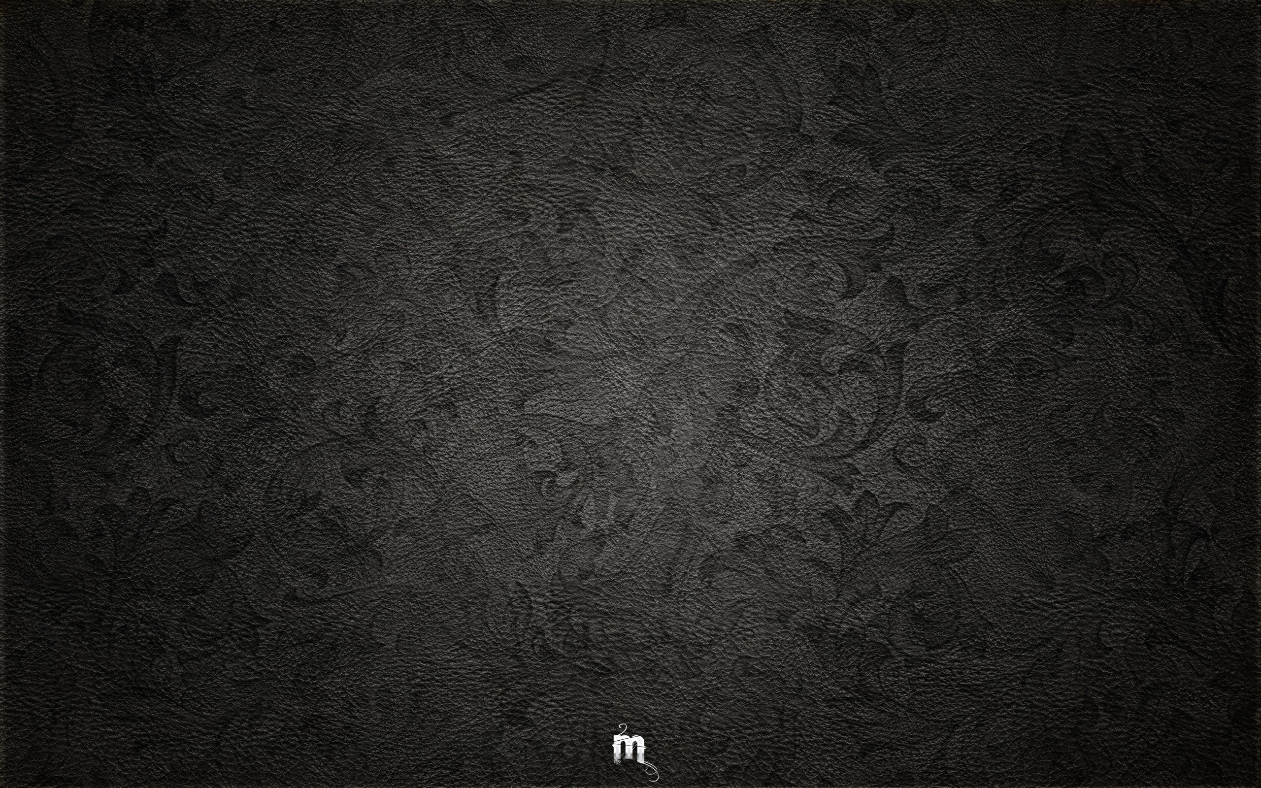 Black textured pattern with a small 'm' logo HD Wallpaper
