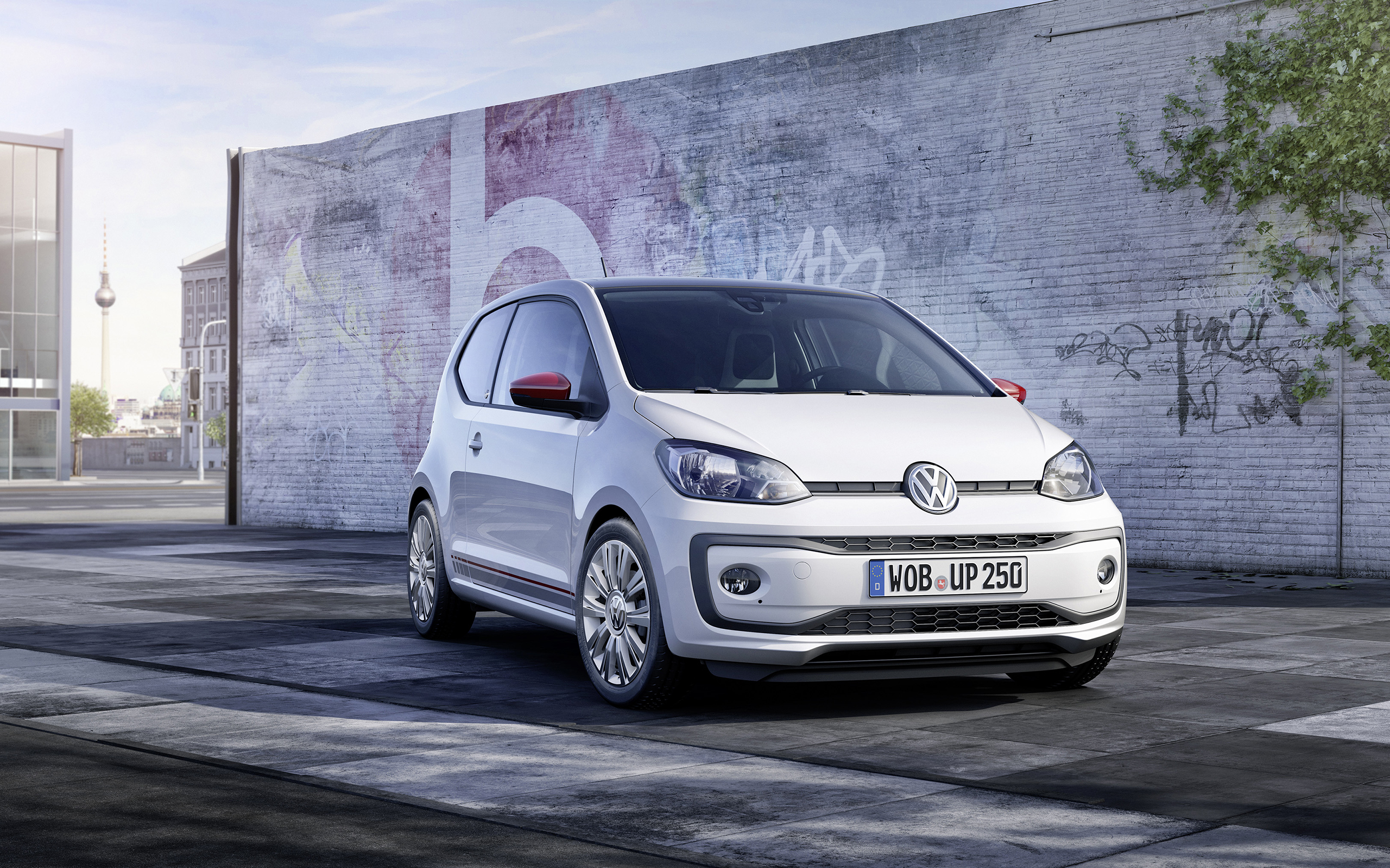 White Volkswagen Up! city car parked on street HD Wallpaper