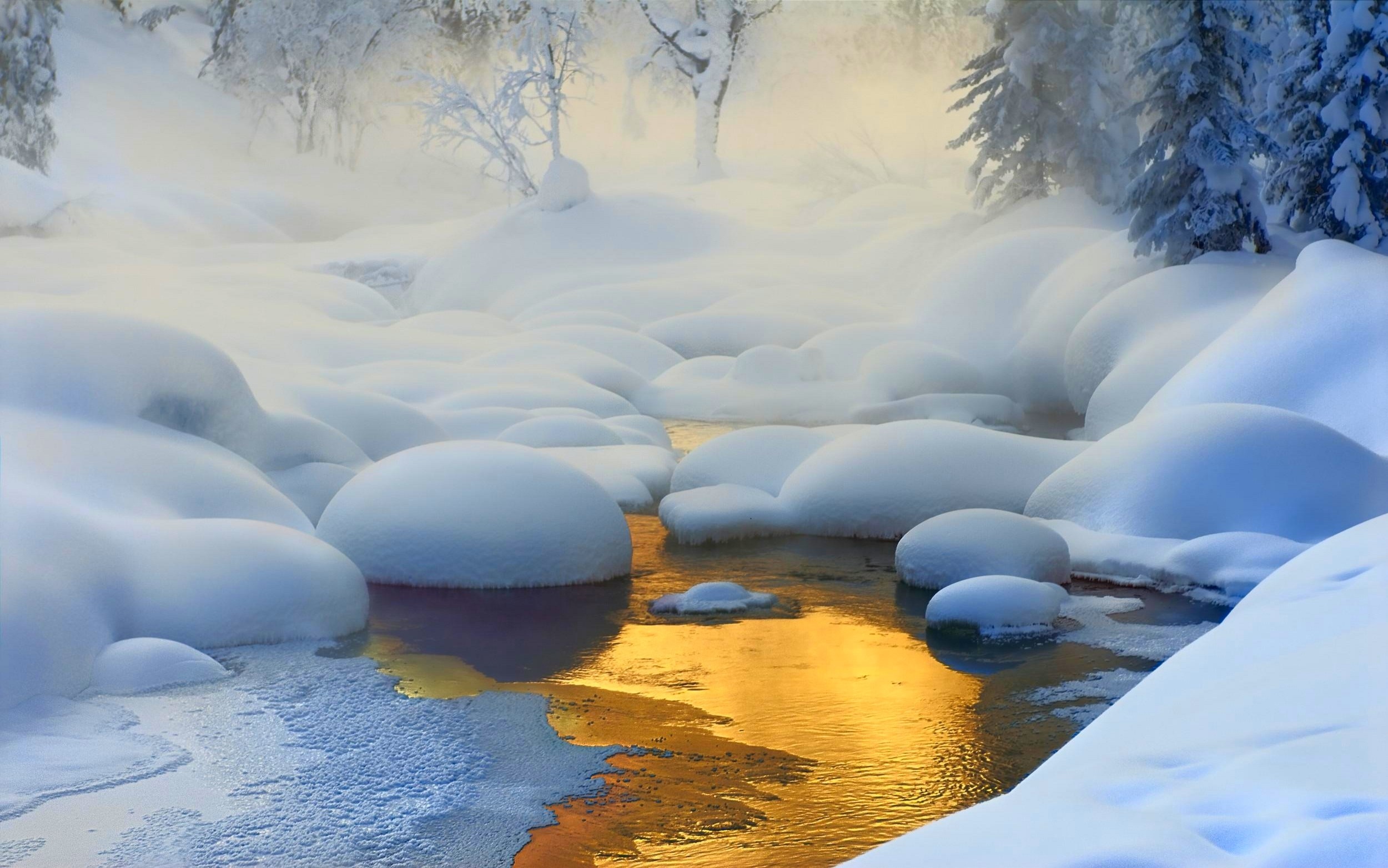 Winter creek with snow-covered rocks and golden reflection HD Wallpaper