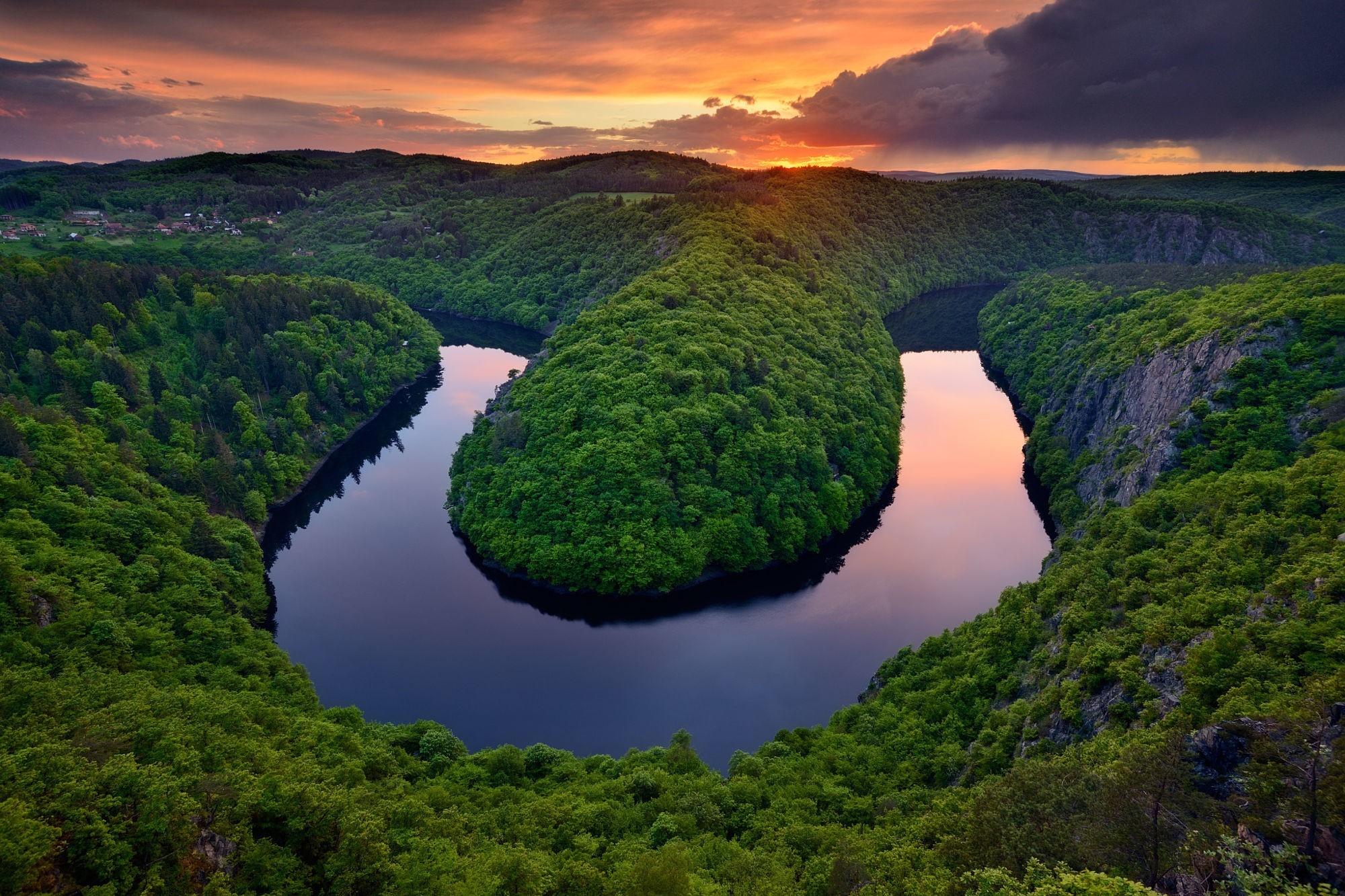Horseshoe bend river surrounded by green forest at sunset HD Wallpaper