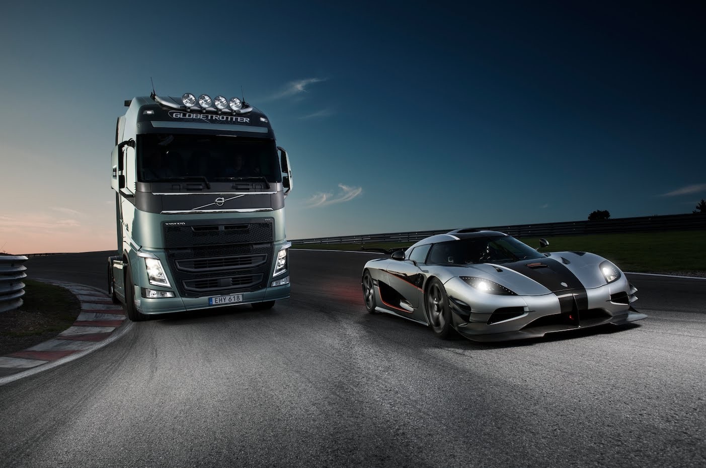 Volvo truck and Koenigsegg Agera on a race track HD Wallpaper