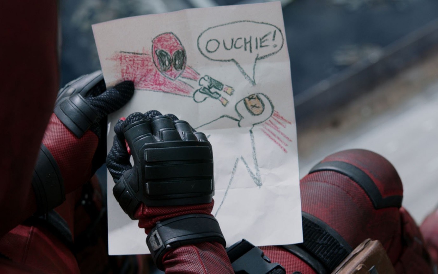 Deadpool holding a drawing of himself shooting someone HD Wallpaper
