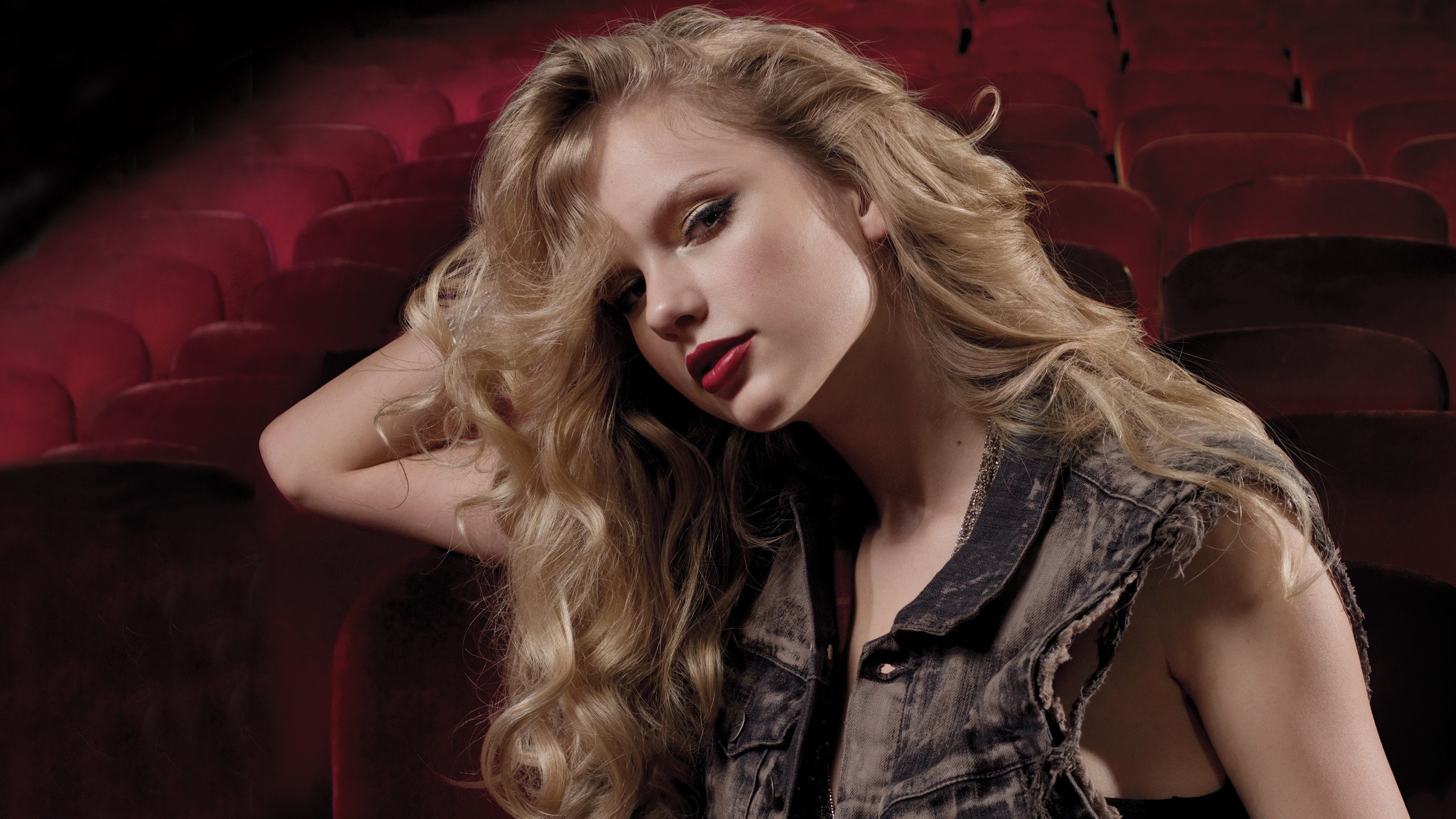 Woman with long blonde hair in a denim vest HD Wallpaper