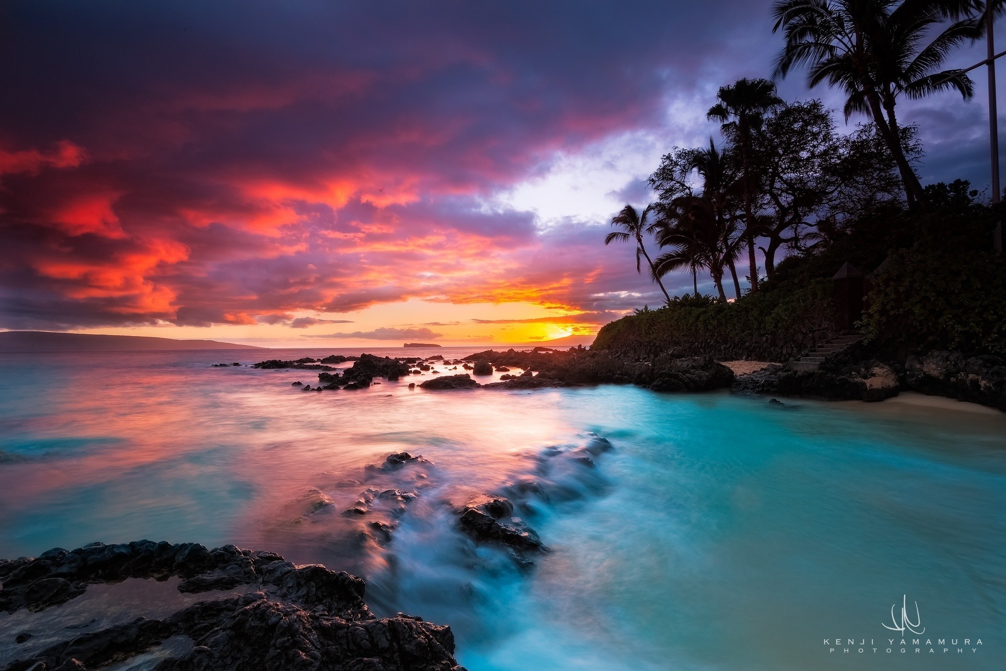 Sunset over a tropical beach with palm trees HD Wallpaper
