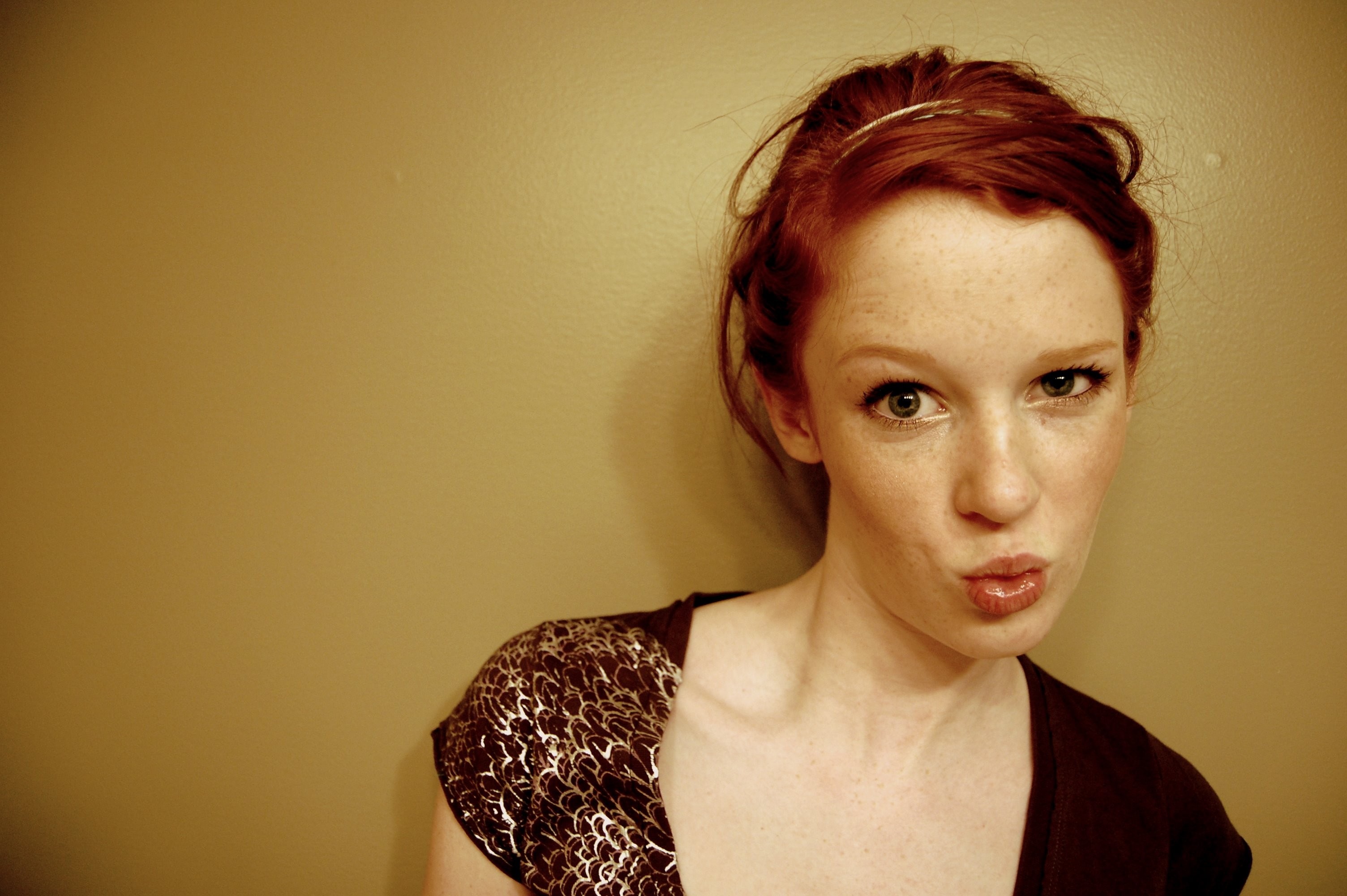 Redhead woman with freckles wearing a patterned top HD Wallpaper