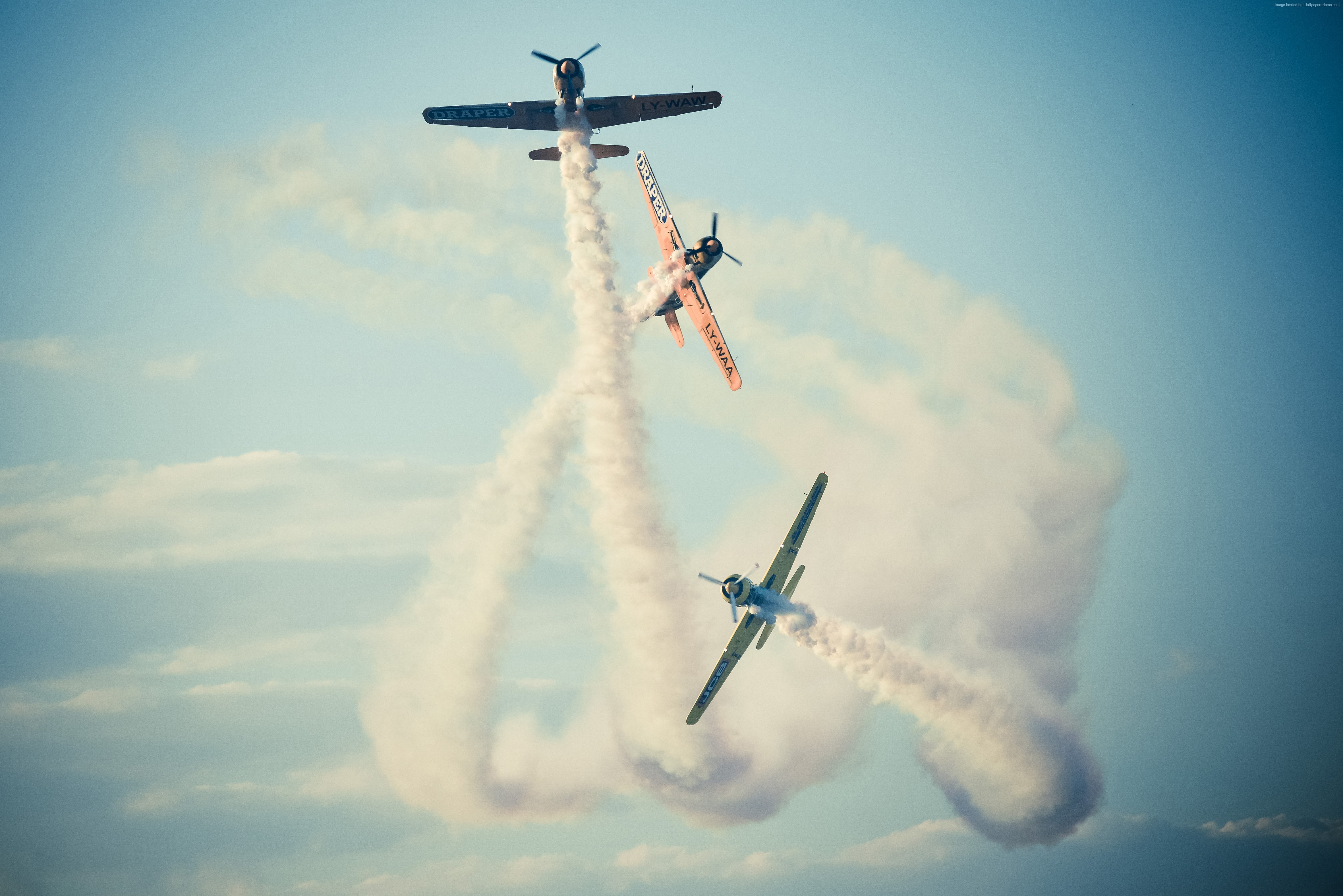 Three planes performing aerobatics with smoke trails HD Wallpaper
