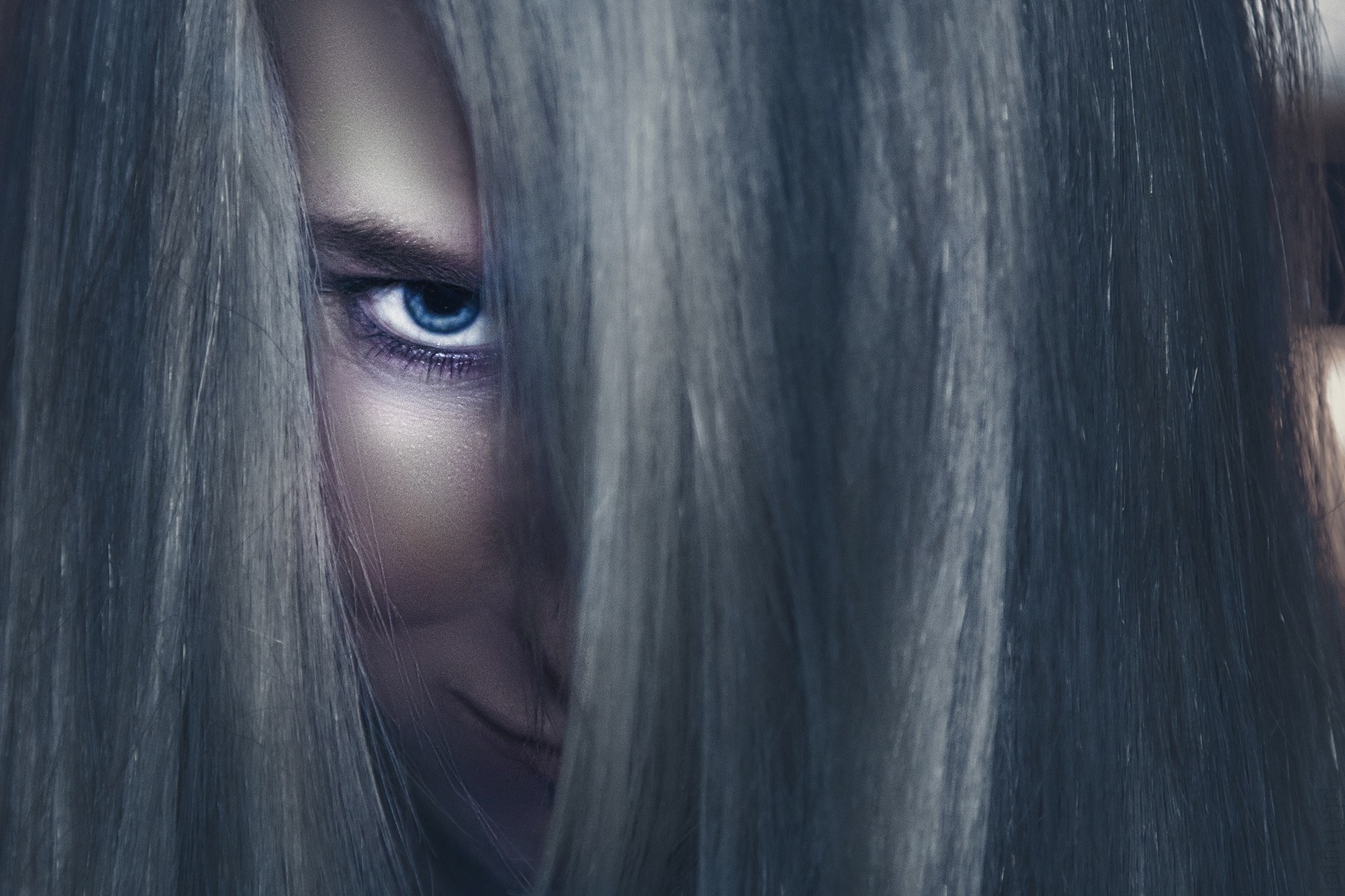 Close up of a woman's face with blue eyes and long hair HD Wallpaper