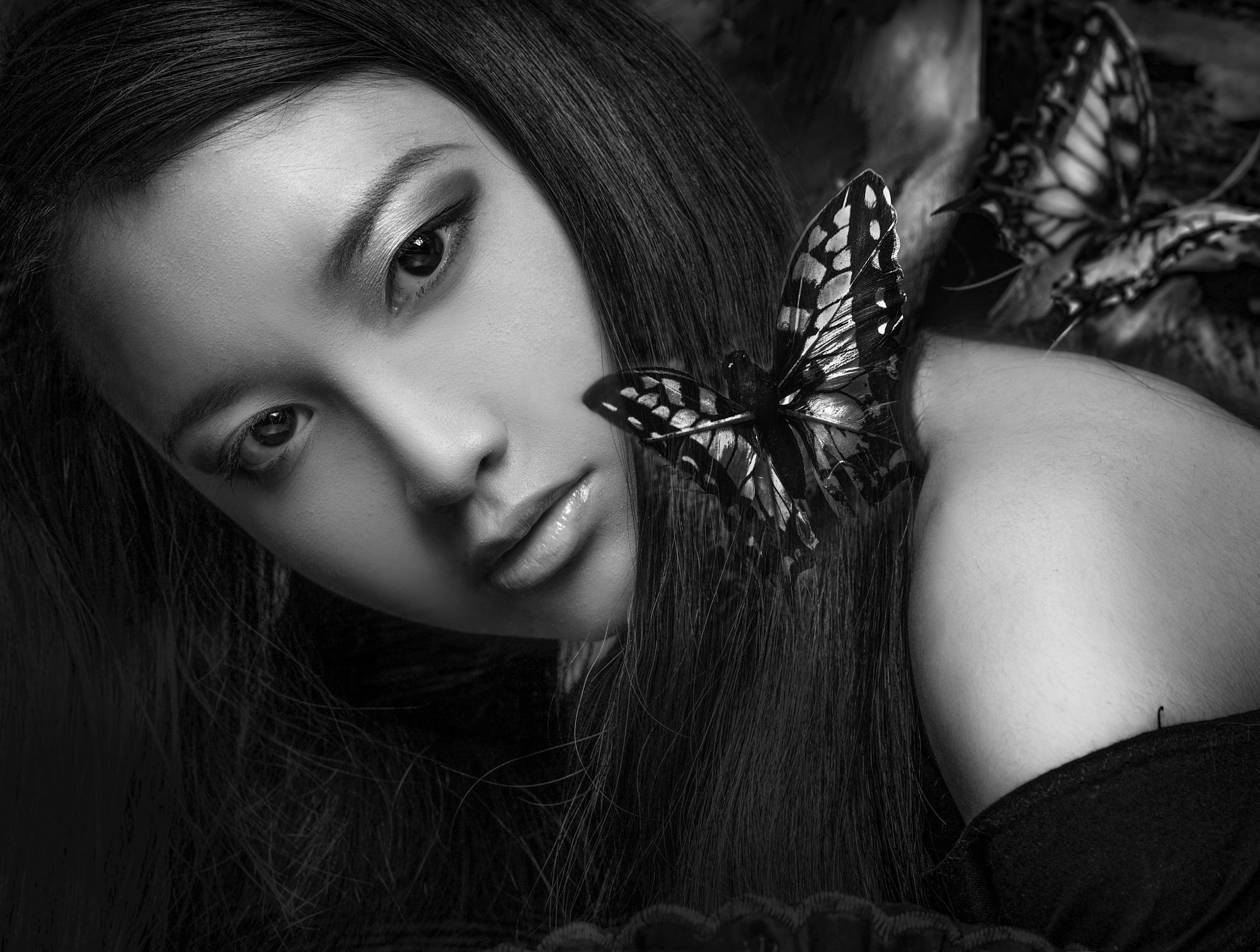 Monochrome portrait of an Asian woman with butterflies HD Wallpaper