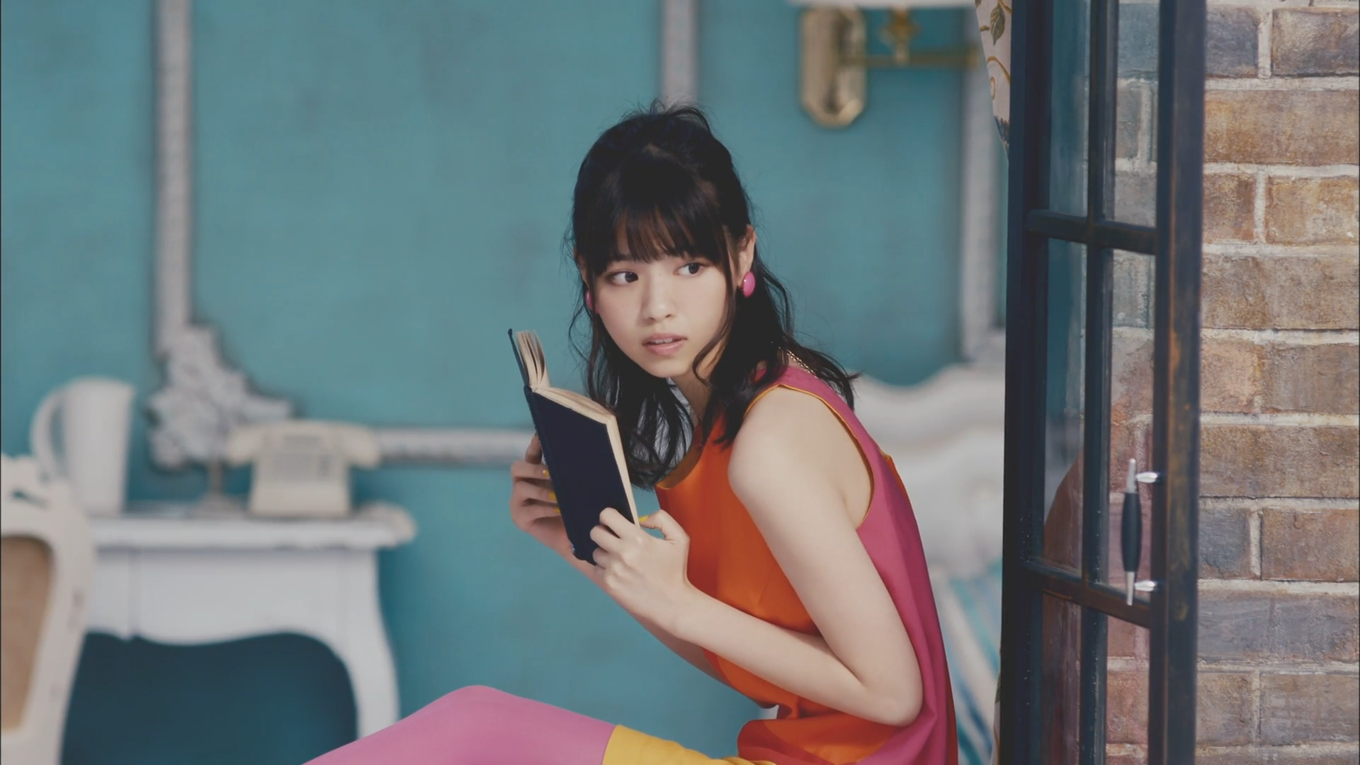 Woman in colorful dress reading a book HD Wallpaper