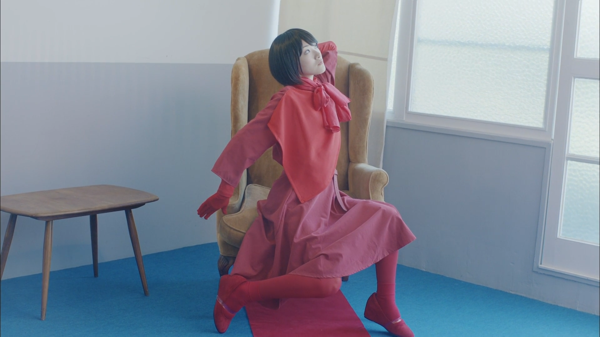 Woman in pink dress and red gloves sitting in a chair HD Wallpaper