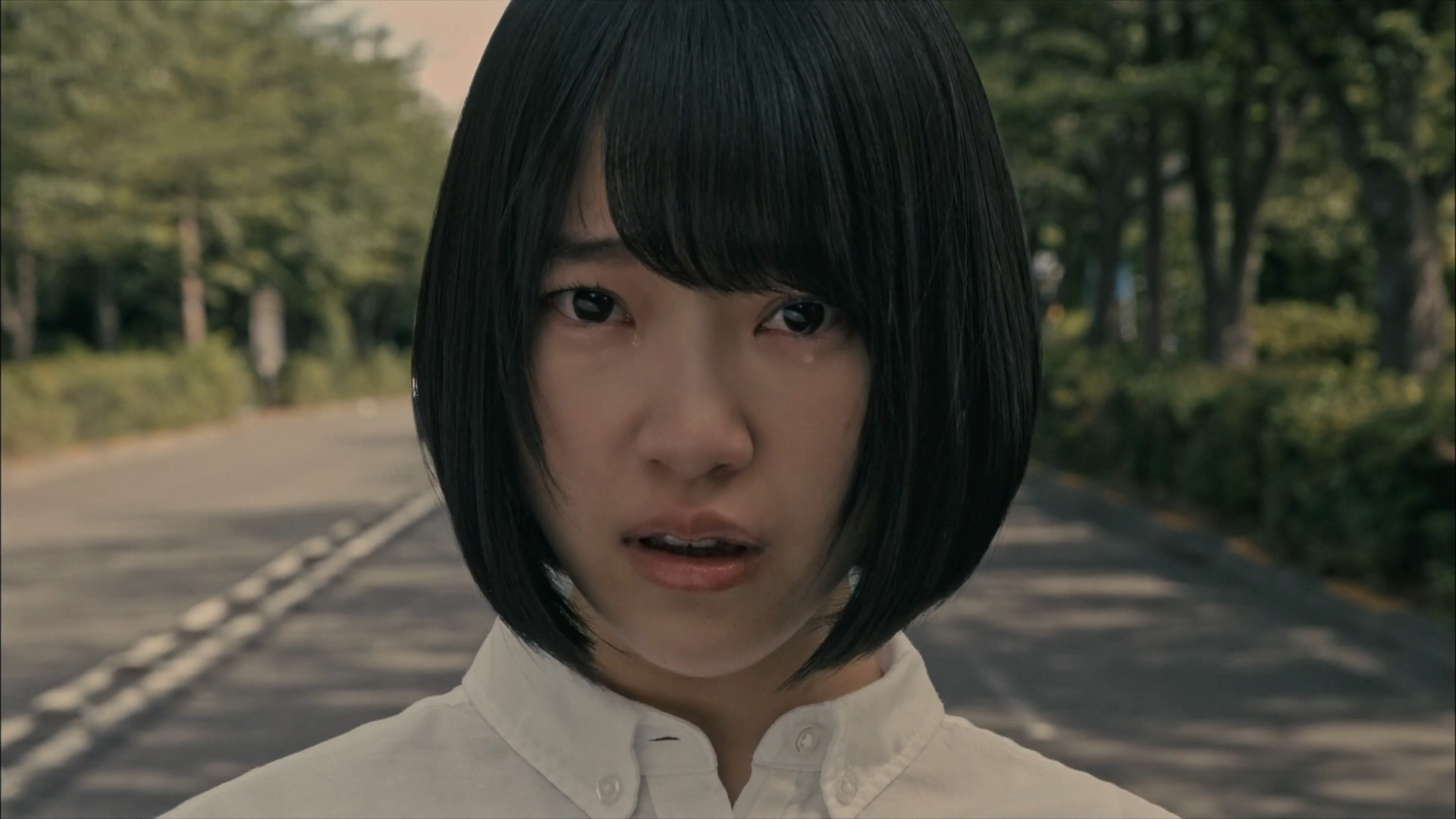 Young Asian woman with short black hair crying HD Wallpaper