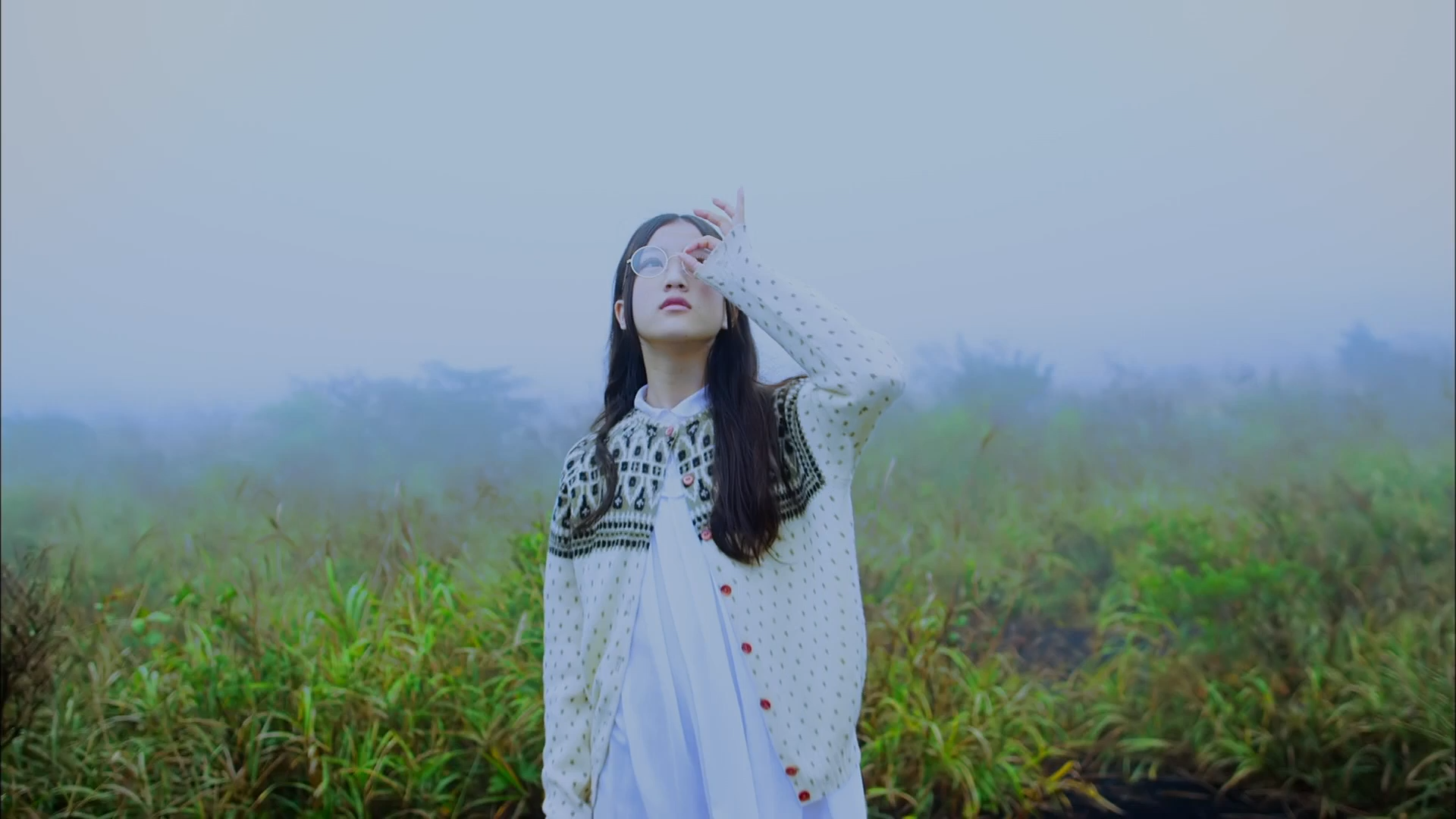 Asian woman with glasses in a cardigan outdoors HD Wallpaper