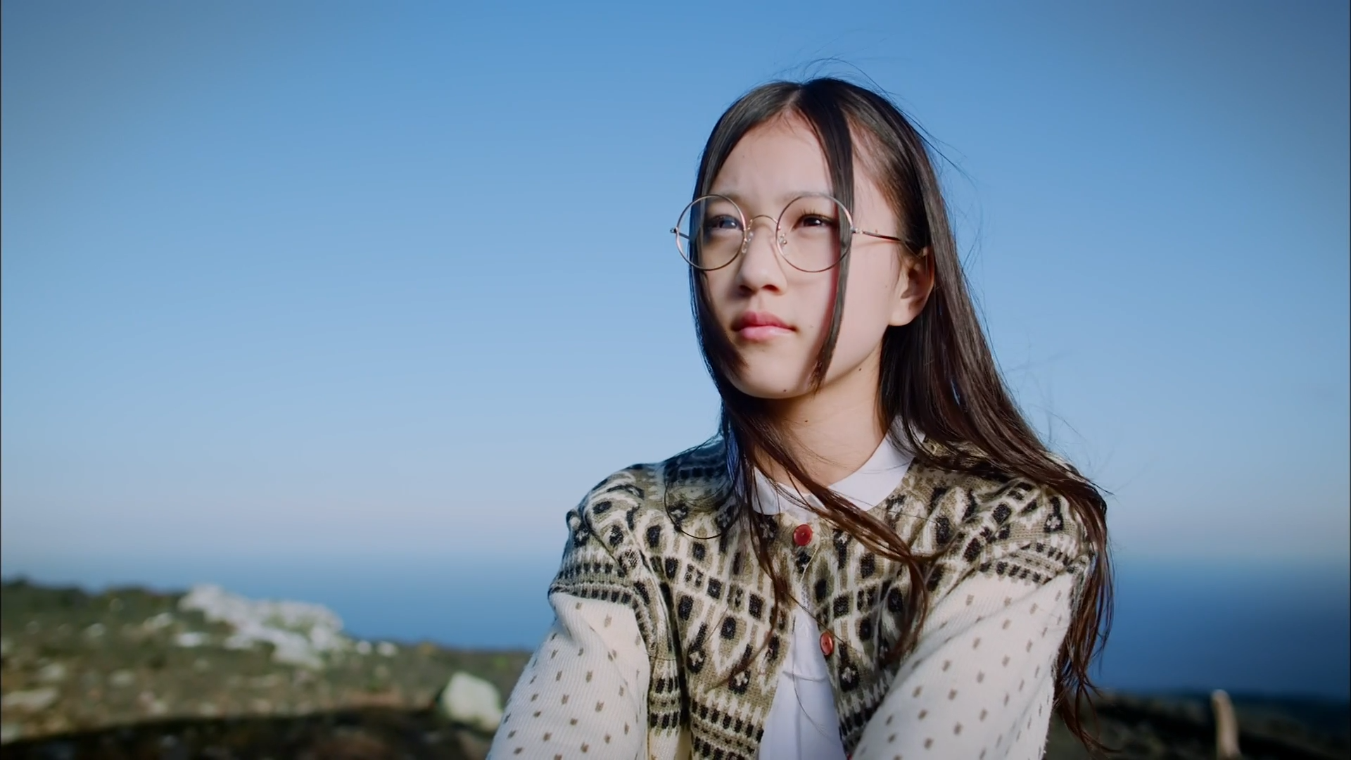 Asian girl with glasses looking away outdoors HD Wallpaper
